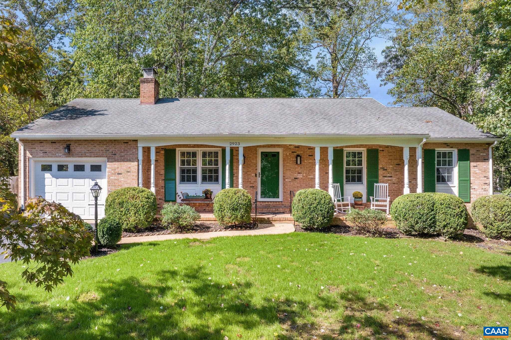 Completely renovated brick home with lots of charm! This adorable home has been tastefully updated w/ many custom touches such as wainscoting, gold hardware & decorative door handles. Hardwood floors in most of the living spaces, and an open floor plan. The kitchen has manufactured Quartz countertops, stainless steel appliances, custom wine and spice racks, and beautifully painted cabinets. There are three bedrooms and two baths on the main level. The Primary bedroom has an ensuite bath with beautiful subway tile and new fixtures.  Brick fireplace on both levels, The lower level has a nice sized family room, and a 4th bedroom that is perfect for guests. There is also a flex space that is currently being used as a workshop. The 1/2 bath on the lower level could be expanded and updated to a full bath. The Screened-in porch has a custom shiplap ceiling and walks out to a huge new deck that overlooks the gorgeous flat backyard. Brick walkways and extensive gardening. Over 1/3 of an acre. Incredible location, walking distance to Woodbrook Elementary. You have all the conveniences of Route 29 at your fingertips. Grocery stores, restaurants, Costco, Trader Joe's, Lowes- All just minutes away.