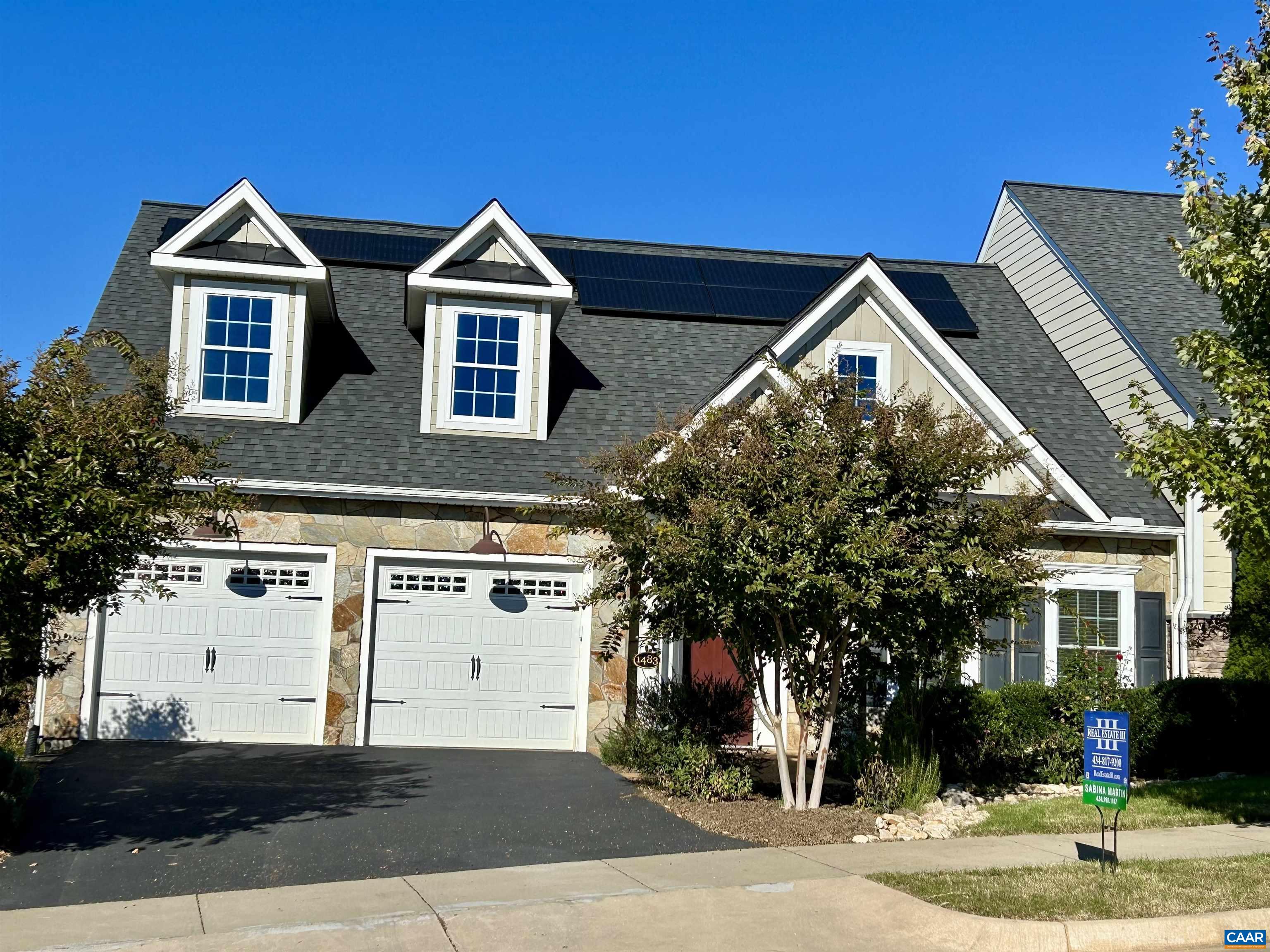 Price just reduced on this gorgeous like-new Southern Development-built villa! With beautiful mountain views & lovely front and back yards, it features a great room with vaulted ceiling, gourmet kitchen, stunning main level primary suite, laundry room & 2nd bedroom & full bath on the main level. The walk-out basement offers a spacious in-law apartment with a bedroom, full bath & 2nd kitchen plus a sewing room/office & an unfinished storage room. Many upgrades include $30,000 solar panels with backup battery installed in 2022 for super low utility bills, $24,000+ in hardscaping & landscaping, reverse osmosis purified water faucets in both kitchen sinks, stunning engineered wood floors on the main level & a central vacuum. Just a short stroll away are the huge community pool & terrace with amazing western views, a large clubhouse, 2 playgrounds, the community garden plots, walking trails, & sidewalks. Close to Darden Towe Park, Sentara Martha Jefferson Hospital, 2 shopping centers & many eateries.