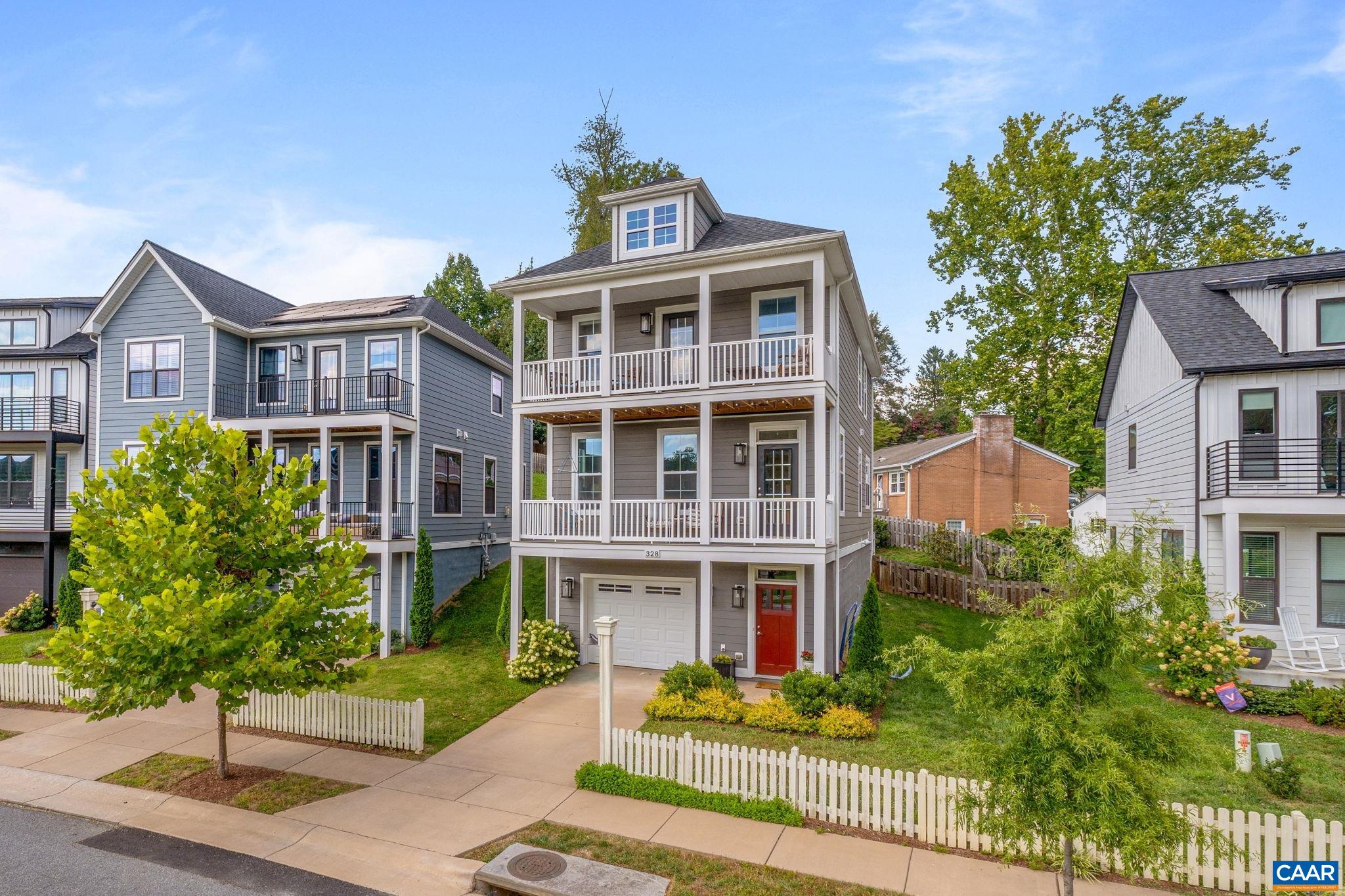 Arguably one of the best spots in Huntley overlooking green space + MT VIEWS from handsome double balcony in the desirable + convenient Fry's Spring neighborhood.  IDEAL LOCATION, an easy bike-ride to all things UVA + Fry's Spring Beach Club + just moments to 5th St Station + Downtown. Built in 2019, the 9' ceilings, hardwood floors, huge windows, gourmet white kitchen + an OPEN floorplan create bright + comfortable modern living. The spacious primary suite feat. a large bathroom, walk-in closet + private elevated balcony w/ mt views!  TONS OF POTENTIAL in fin. basement Rec Room level w/ 9' ceilings + garage. LOW-MAINTENANCE YARD - HOA mows! Icing on the cake? SOLAR panels!