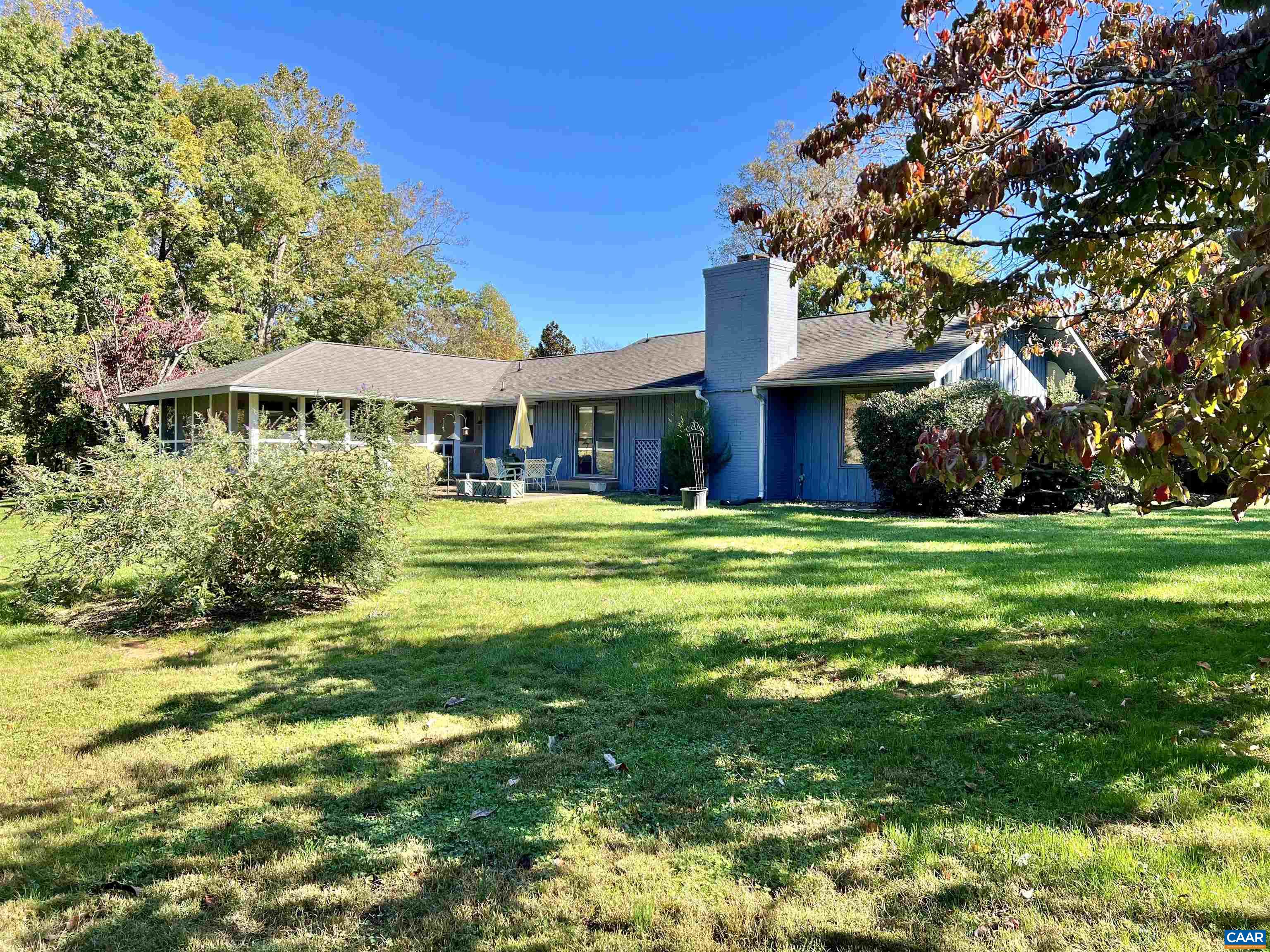 Nestled on a picturesque 4.41-acre lot, this charming home offers a blend of comfort and outdoor beauty. The property features a fenced garden area, perfect for cultivating flowers, vegetables, or herbs. A large patio creates an ideal space for entertaining, while the screened-in porch provides a cozy spot to enjoy the outdoors without worrying about the elements. Inside, natural light fills the open spaces, accentuating the home’s warm, inviting atmosphere. With two spacious bedrooms and three bathrooms, this home offers plenty of room for relaxation and privacy. Car port and large out building and tractor shed, ideal for studio, storage, tools, seasonal items, or recreational equipment close at hand. This property seamlessly combines indoor and outdoor living, making it a peaceful haven for garden lovers and entertainers alike.