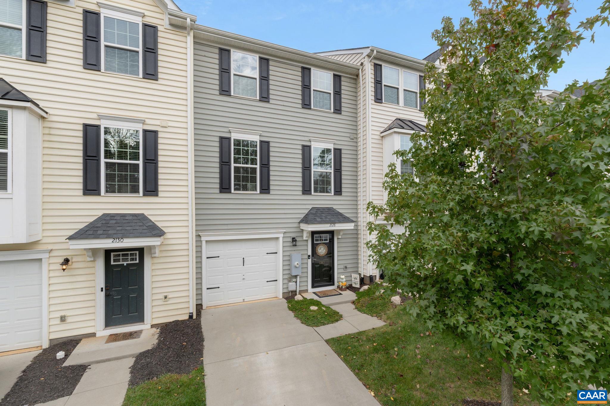 Like-new, meticulously maintained townhome located in the Riverwood community in northern Albemarle. This home sits on a great lot within the neighborhood across from a tree-lined common space, the community playground, and plenty of guest parking. The main level features an open floor plan kitchen, dining, and living area that feels modern and spacious. The dining and entertaining space is extended with a deck that overlooks the fenced backyard. On the upper level, there is generous primary suite with a huge walk-in closet and an attached bath featuring a walk-in shower. Two additional bedrooms, a full bath, and laundry area round out the upper level. The terrace level offers a garage, storage, and a great rec space that could serve as a playroom, office, or den. The terrace level enjoys access to the fully-fenced backyard. This wonderful home is less than 5 years old, completely move-in ready, and HERS energy-rated. The Riverwood community is 15 minutes north of Charlottesville and just a few minutes to NGIC, CHO, UVA Health and shopping. HOA fee includes front yard landscaping, trash pickup, snow removal, and common area maintenance. This home qualifies for a special one-year rate buy down!