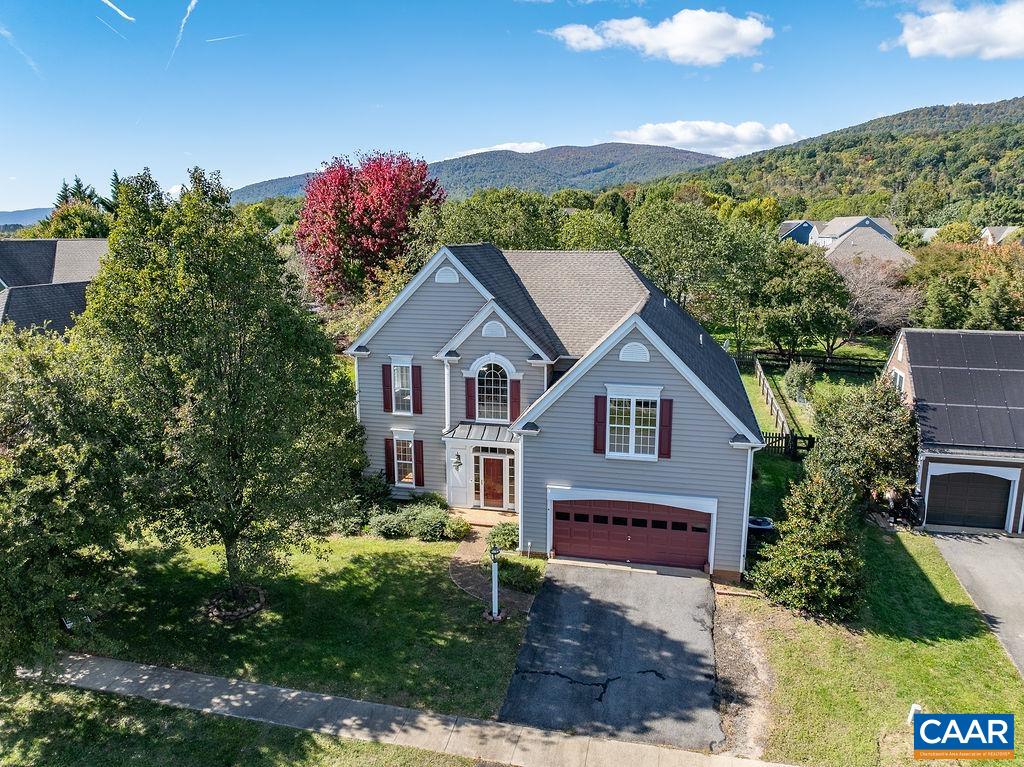 Ready to live in one of the prettiest neighborhoods in Crozet?  Do not miss this Craig Builder's Beauty with first floor primary ensuite, four additional bedrooms and two full baths on 2nd floor, two car garage and flat fenced yard with Blue Ridge Mountain views!  Hardwood floors, nine foot ceilings and a gorgeous 2-story great room with fireplace.  Grayrock offers mature trees, sidewalks, playground, and just a short walk or bike ride to downtown Crozet!