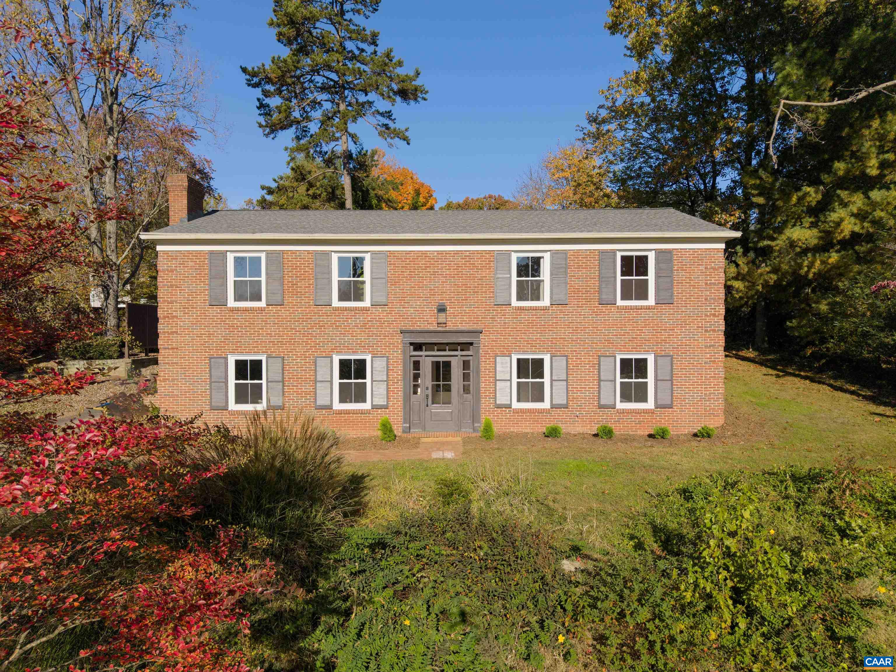 Who knew it was possible to find an uber-sophisticated, well executed reno in a perfect location just minutes to all things Charlottesville? This thoroughly updated 2,700 sq ft, 4 BR, 2 BA home offers a functional, versatile floor plan that has been completely updated for a modern lifestyle. Not only will you be wowed by the tasteful finishes (Quartz counters, Carrera marble, custom tiles, excellent light fixtures), you’ll be thrilled to know that the less glamorous work has ALSO been taken care of- the roof, windows, exterior doors, waterproofing, electrical and HVAC systems ARE ALL NEW! Fresh paint throughout and ALL NEW light fixtures, stainless appliances, low maintenance commercial grade LVP floors, plumbing fixtures, and contemporary black matte door handles/hardware too. Both the Living Room and Family Rm feature handsome, brick, wood-burning fireplaces. The elevated lot provides loads of privacy in the back yard for outdoor fun and ample off-street parking. Super-sized deck is new, multi-level with stylish cable railings. This hidden gem of a neighborhood is quiet and private, with no through streets and biking/walking distance to Barracks Rd shopping/UVA.