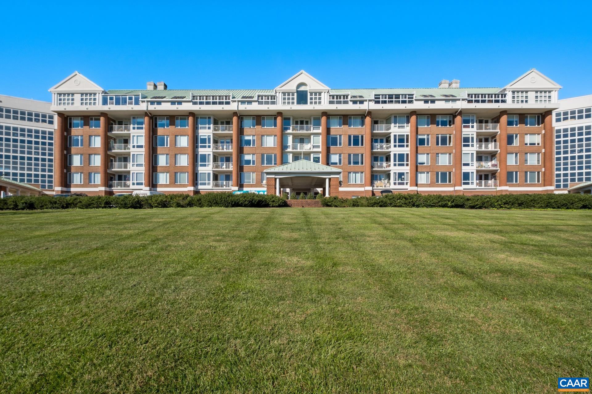 Spacious 2 Bedroom, 2 Full Bath home with beautifully landscaped view from the balcony is ready for a new owner.  This Western Facing View Unit comes with one covered parking spot and unconditioned storage space.  With Generously sized Bedrooms, pocket doors to large walk in closets, good sized bathrooms and ample kitchen space, you won't want to miss this.  University Village is a fascinating active adult community with an ideal location and abundance of amenities.  University Village offers their residences a heated year round indoor pool, exercise room, library, meeting rooms, many interest groups, movies and more.  Condo fee covers: basic cable, electricity - heating/cooling, water, sewer, gas, trash, community amenities, reserve funds.  Owner is responsible for air handler maintenance, interior condo maintenance, WIFI, telephone, and any extra cable beyond the basic cable provided.  Ideally located near shops, restaurants, grocery stores and UVA.
