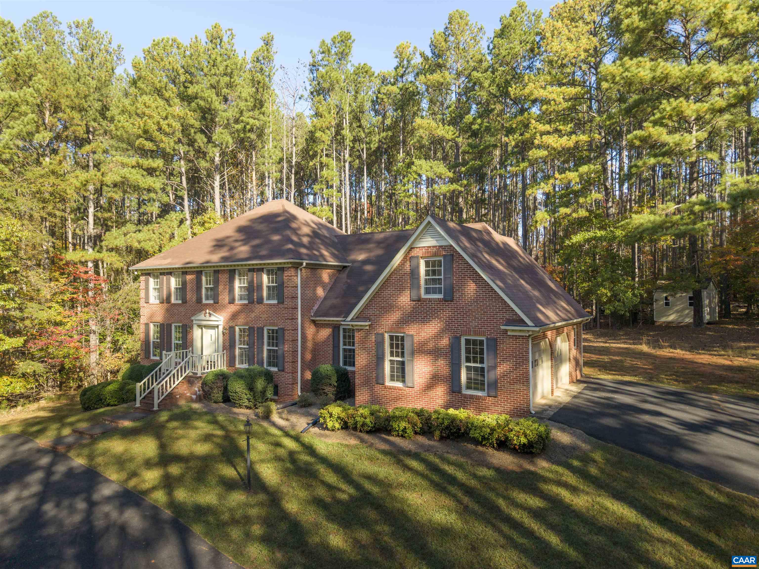 Classic 2 story brick residence set on a 3.6 acre lot in the Ivy Elementary School District....First floor guest suite....bright, updated kitchen....Front and rear staircases ...Spacious bedrooms....Hardwood floors, brick fireplaces, sunroom opens from family room and out to the deck, formal dining room, and living room...Full terrace level features a family room with brick fireplace, a home office, playroom and a full bath... First floor laundry room and bright oversized 2 car garage.
