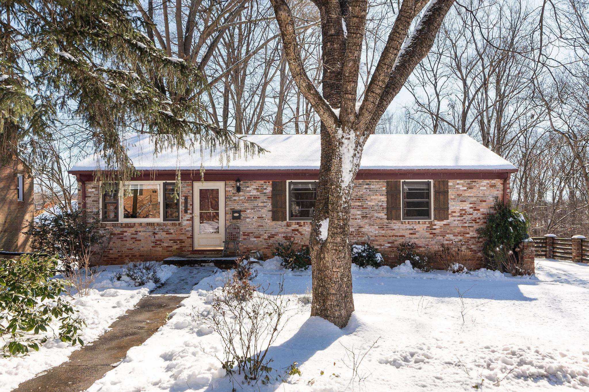 Start your new chapter in the heart of Charlottesville’s FRY’S SPRING neighborhood! This 4 bed, 1.5 bath c.1960s brick ranch offers the best of both worlds - super convenient location minutes from Downtown Charlottesville, UVa, and the interstate while being tucked quietly into neighborhood life. Hardwood floors throughout the SUNNY living spaces and 3 bedrooms on the main level, with a FINISHED WALKOUT basement offering additional living space and a 4th bedroom, with potential to be used as a private home office or guest suite. Enjoy mountain views on the deck, patio, or from the terraced garden with its RAISED BEDS and mature fruit trees. Be sure to see the included photos of the gardens in full bloom for something to look forward to this spring! Basement also includes unfinished utility room with workshop and storage space. Exterior cellar could be used as a potting shed or for additional storage. So much to love, offered under $500k and ready for you to make home! OPEN HOUSE SUNDAY 1/12, from 1-3PM!