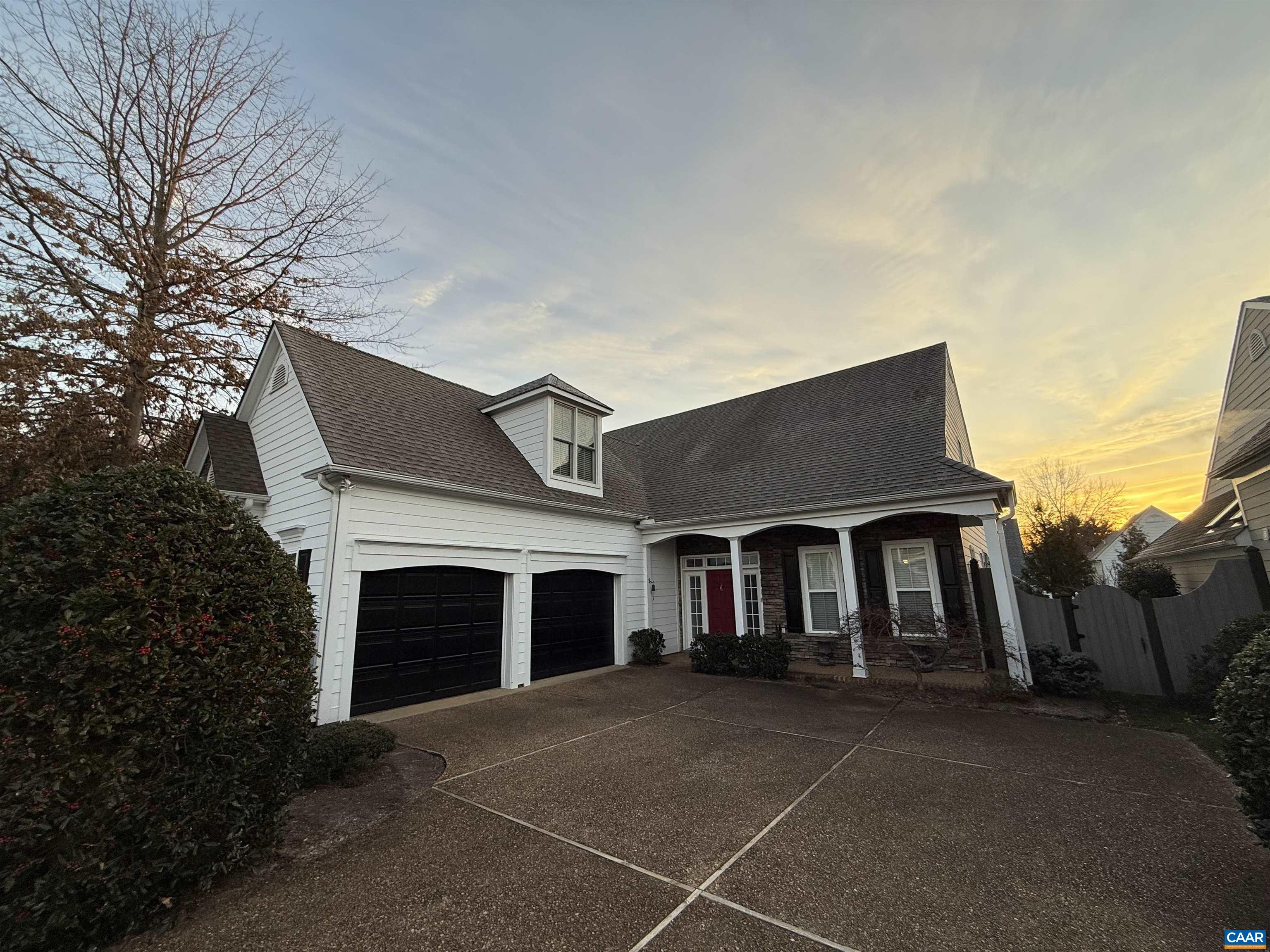 Discover luxury in this pristine Stonegate home, where elegance meets exceptional functionality. With exterior paint and landscaping provided by HOA this is a convenient low-maintenance community. Hardwood floors and natural light flow throughout. The gourmet kitchen is a culinary masterpiece featuring granite countertops, a professional Wolf gas range, Bosch dishwasher, and Samsung refrigerator. A custom wood-topped island anchors the space, flanked by two generous pantries. Upgraded lighting and a stylish backsplash complete the chef's dream. A spacious family room with vaulted ceilings opens to a charming sitting room and sun-drenched sunroom. The thoughtfully designed office/library with built-ins offers the perfect workspace, while surround sound creates an immersive entertainment experience. The luxurious owner's suite is a true sanctuary, featuring hardwood floors, a tray ceiling, and French doors. The en-suite bathroom is a spa-like retreat with a custom vanity, walk-in tiled shower, and marble flooring. Three meticulously organized closets provide ample storage. A Jack and Jill bathroom, custom-cabinetry laundry room, and 2.5-car garage add to the home's practicality.
