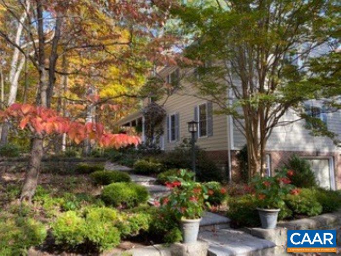 Fabulous home in Ivy...lovingly cared for and updated over the past 40 years by the current owners...Beautifully landscaped yard...The screened porch and rear deck extend the living space...great backyard leads toward the woods... Family room (with stone fireplace) opens to the deck and kitchen...Terrific terrace level recreation room features a fireplace and sliding doors to the back yard...Hardwood floors throughout...large driveway...peaceful and quiet..