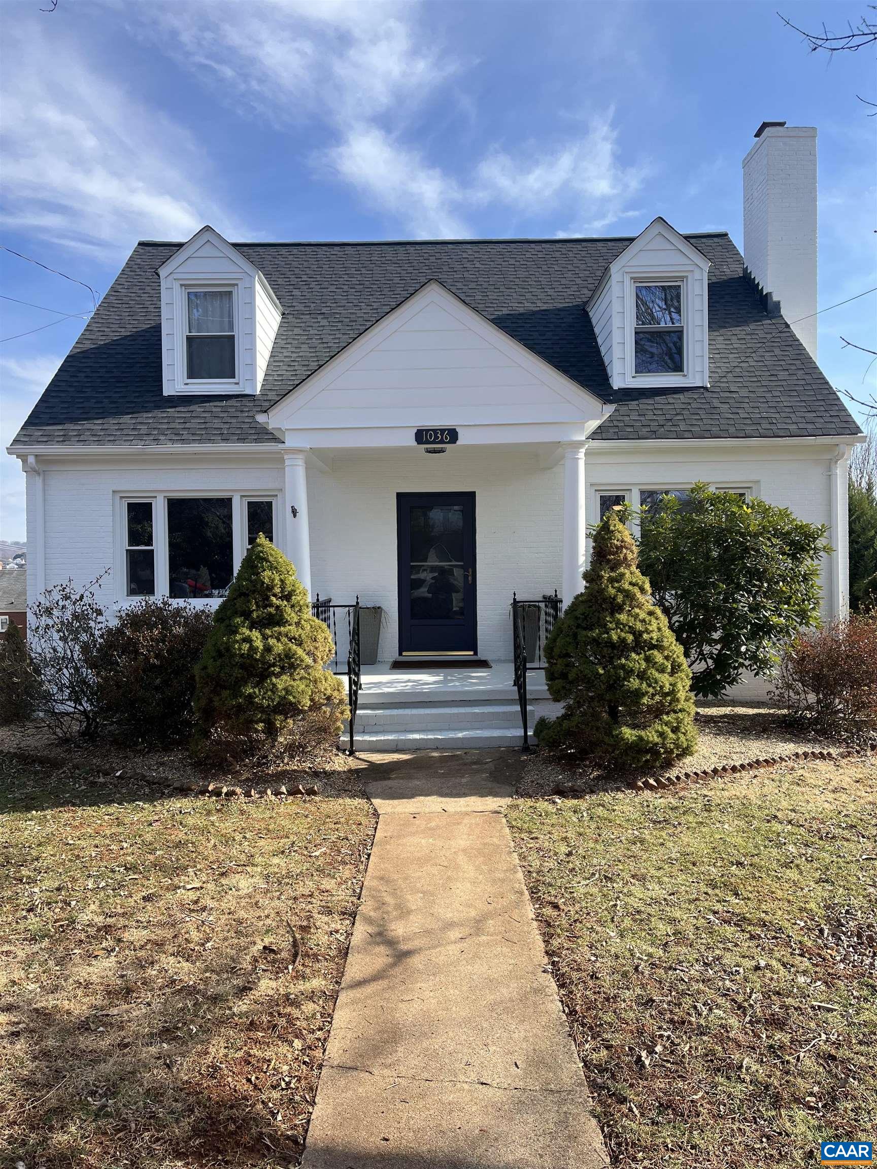 ++ Price Improvement ++ Discover this captivating residence on highly sought-after Locust Avenue! Recently renovated, this home beckons its new owners and is just moments away from all that C'Ville has to offer. This Cape Cod home boasts an impressive amount of space! With beautifully restored original hardwood flooring, the main floor features a newly renovated kitchen that flows to an elegant dining room; the primary bedroom with renovated ensuite bath, and a cozy family room with a brick fireplace. Upstairs features three large bedrooms and renovated full bathroom. Step outside from the kitchen onto the revamped screened porch to enjoy your morning coffee while overlooking the large backyard, ideal for a small garden or entertaining! Additionally, don't overlook the fully renovated walk out basement complete with a full kitchen, two bedrooms or bonus rooms, and a full bathroom; perfect for a short term rental or an in-law suite. Furthermore, take advantage of off-street covered parking accommodating three vehicles in the detached garage with electricity and a carport! This home presents an abundance of amenities and opportunities and is a short walk away from a Rivanna Trail trailhead.