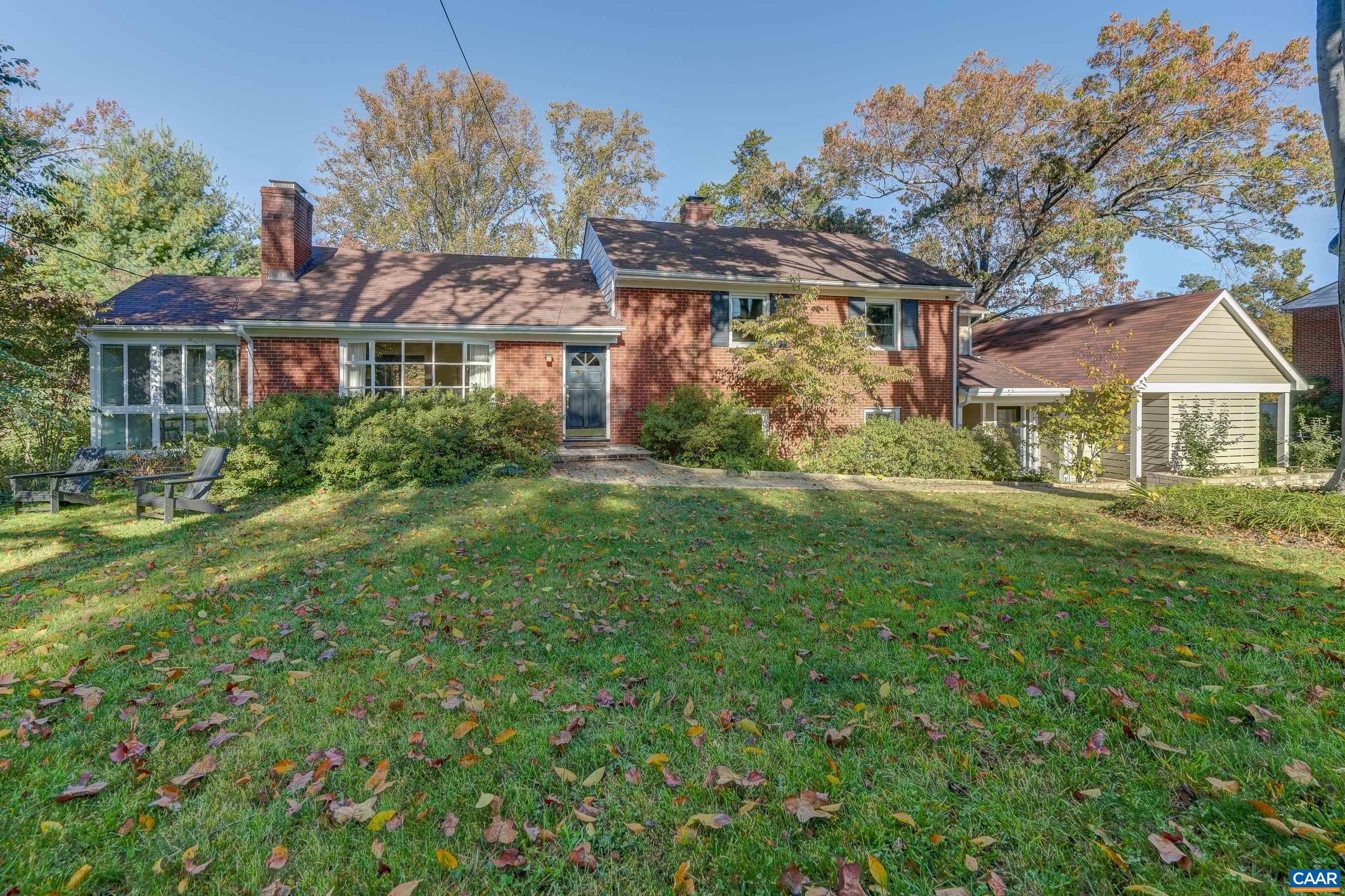 Rarely available property in park-like setting in Meadowbrook Heights with guest house! You'll love this remodeled and upgraded home with hardwood floors and lots of natural light throughout.  Almost an acre of park like yard includes beautiful gardens and mature landscaping.  The open main level features a large living room adjoining the dining room and updated kitchen.  The kitchen remodel allows great workspace and flow for easy entertaining and cooking. Beautiful soapstone countertops and cheery painted cabinets! Work from home or enjoy the sunshine and a good book in the spacious glass enclosed sunroom. Upstairs, the primary bedroom features a large remodeled ensuite bathroom with walk-in shower, and two large closets.  Two additional bedrooms share a remodeled full bathroom upstairs.  The lower level features a large den/rec room with fourth bedroom and half bath.  The newly built guest house is the perfect spot for in-laws, guests or income generating rental. Modern guest house features a large living room with skylights, kitchenette, bedroom and full bathroom. So many options for multi generation living or short term rental.  Don't miss this great opportunity for an updated home walkable to downtown and close to UVA!