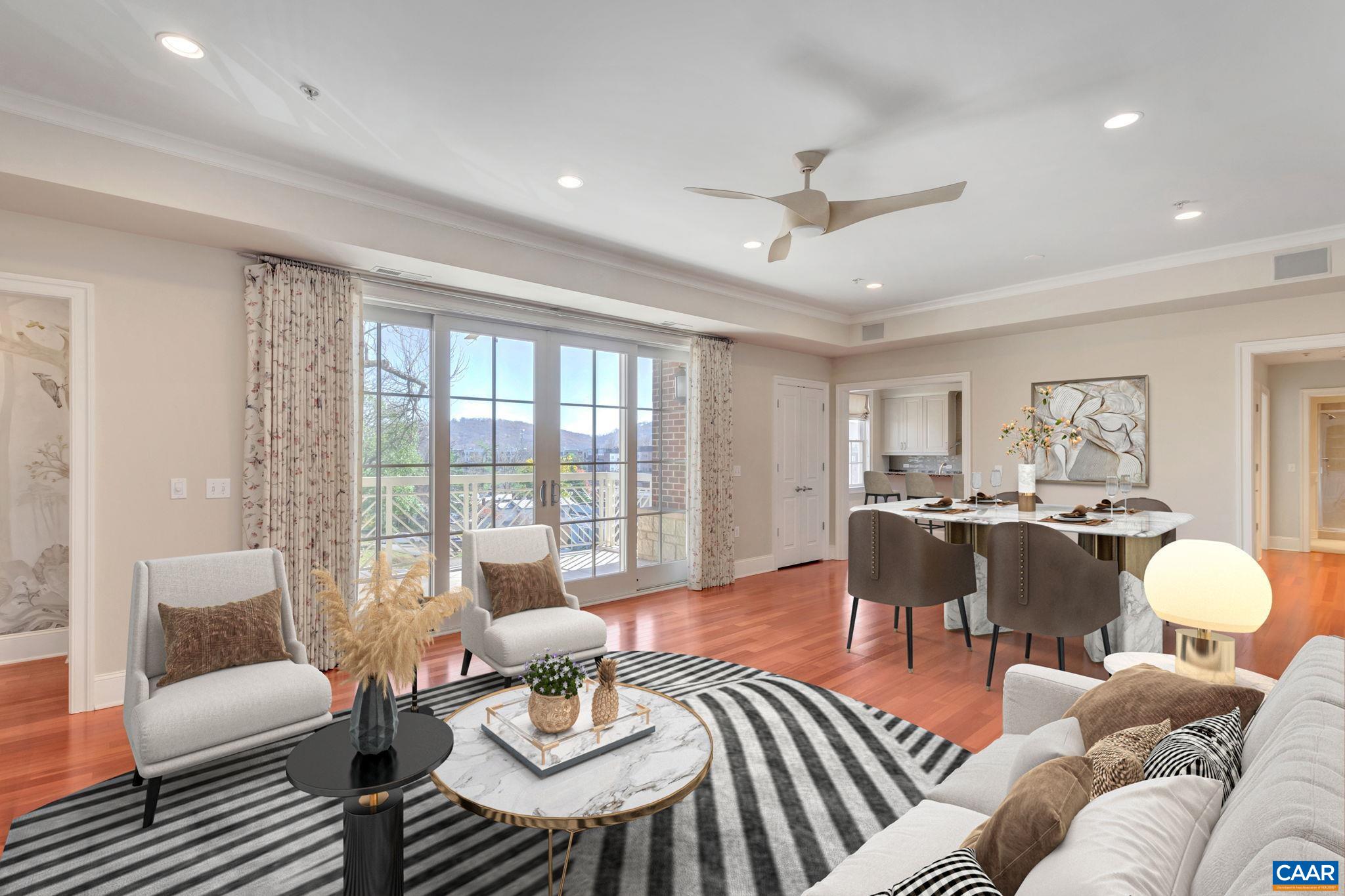 Premium end unit in The Randolph, secure lobby, two designated tandem garage parking spots,  windows & views in all rooms of Carter's mountain, large outdoor covered porch off great room, wonderful for entertaining or relaxing. Just 3 blocks to the historic pedestrian mall, restaurants, shops, entertainment, relax on your covered balcony with views of Carter's Mnt.This popular one level floor plan enjoys a large entry foyer, eat-in kitchen with office nook, plenty of custom cabinetry, Miele Gas Stove & Hood. Large great room, cherry flooring, gas fireplace, private owner's suite, separate home office and light filled 2nd bedroom/den at opposite end of the condo enhances privacy for guests. Upgrades in this unit include custom built-ins throughout, designer custom walk-in closet with cedar lined cabinets, renovated kitchen, hand painted mural in foyer, newer HVAC, custom drapes with Italian fabric. HOA includes water, sewer, gas, common area and exterior maintenance, in this 5 story steel and brick premium condo in DT. Walkable to just about the entire city!