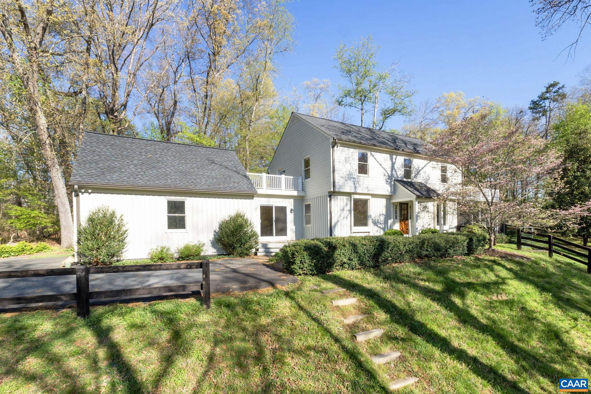 Privately situated in the heart of desirable Free Union, this classically styled home features well considered indoor and outdoor spaces and has been tastefully and completely renovated.  Overlooking a pond and the woodlands beyond, the entrance level offers both living and family rooms, the latter with a gas fireplace and built-in book shelves, as well as a open kitchen, just off the dining room.  Additionally, the first of two primary bedroom/bathroom combinations is found on the main level as is a half bath, the laundry and a large screened porch.  The second floor features 3 additional bedrooms including a second primary suite,  access to a roof top balcony and a generous storage space above the garage.  Partially fenced and with a paved drive, ample garage space and a large and level patio, this home and land will not disappoint.