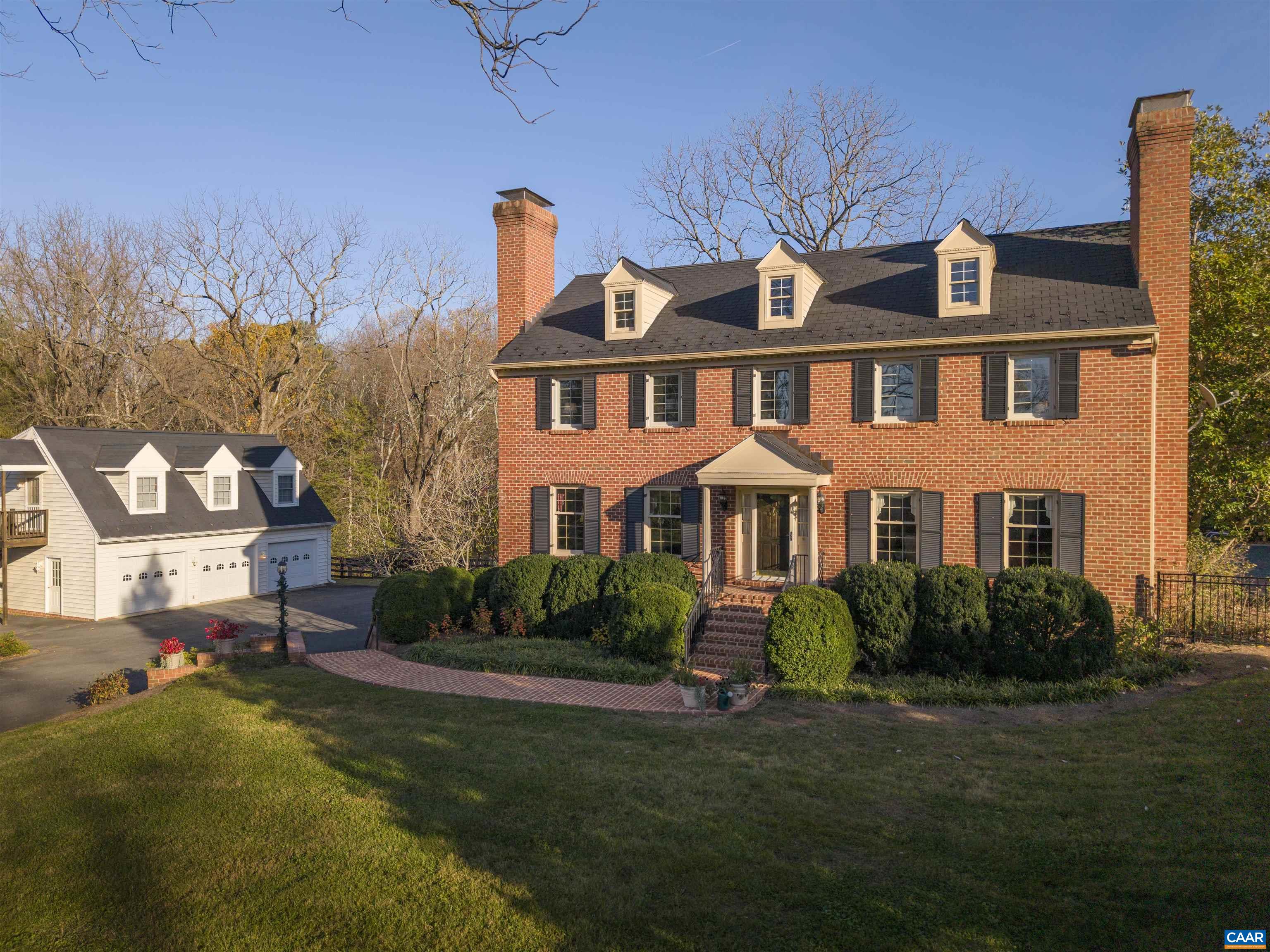 20-acre estate caliber property minutes from Charlottesville.  A classic, well-built brick residence with 4 bedrooms, 2 full baths, and 2 half baths, finished walkout basement, pool, 3-bay garage and apartment sits nestled into the rolling acreage of this exceptional offering.  A second, elevated site with an existing cottage enjoys exceptional mountain views and privacy.  Keep the charming cottage or build something new. UPPER SITE HAS HUGE POTENTIAL.  Perfect as a main residence or family compound. Less than 10 minutes to downtown Charlottesville, yet completely private.