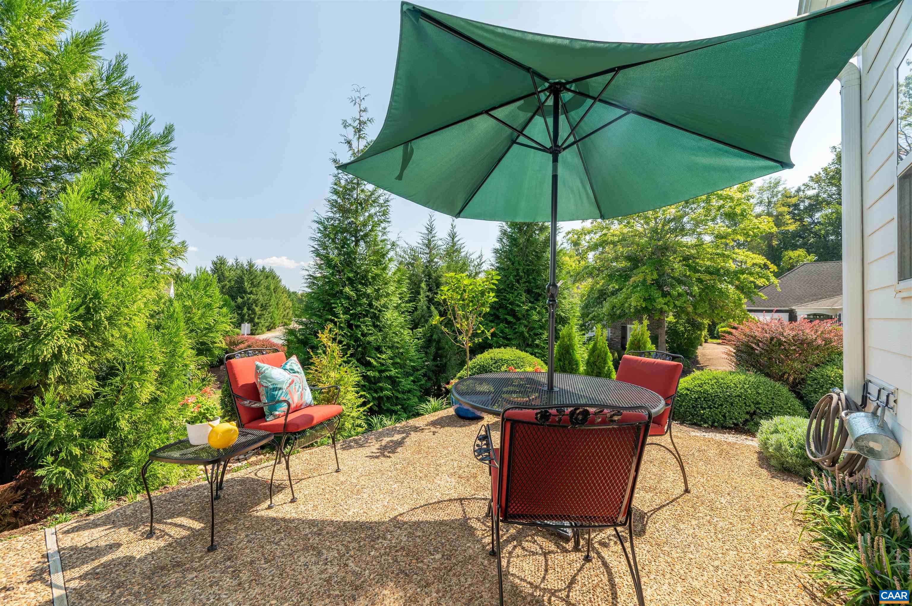 Stunning Craig-built home on corner lot. This light filled home offers flexible, one level living, as well as amazing upstairs space with additional primary suite. Additional features include vaulted living room ceilings with skylights, gourmet eat-in kitchen, built-in shelving, double sided glass fireplace to living room and sun porch, attic storage space, and two car garage. The beautifully landscaped yard includes an inviting outdoor patio, perfect for privacy. Perennial garden lines a pea gravel pathway.