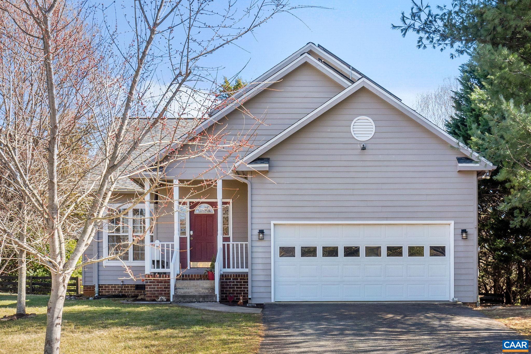 Great opportunity to own a home in Crozet! This home features hard wood flooring throughout both levels, a fenced-in backyard with mountain views and a side deck. First floor has Primary Bedroom and Bathroom with vaulted ceilings, a gas fireplace  in the Living Room, an island in the kitchen, Refrigerator and Dishwasher are a year old as well as the Hot Water Heater. There is a two car garage with plenty of room for storage! Roof was replaced in 2019 and Solar Panels were installed in 2020! Gutter Guards by Leaf Filter. Newly renovated half bathroom! Schedule a showing today this house won't last long!