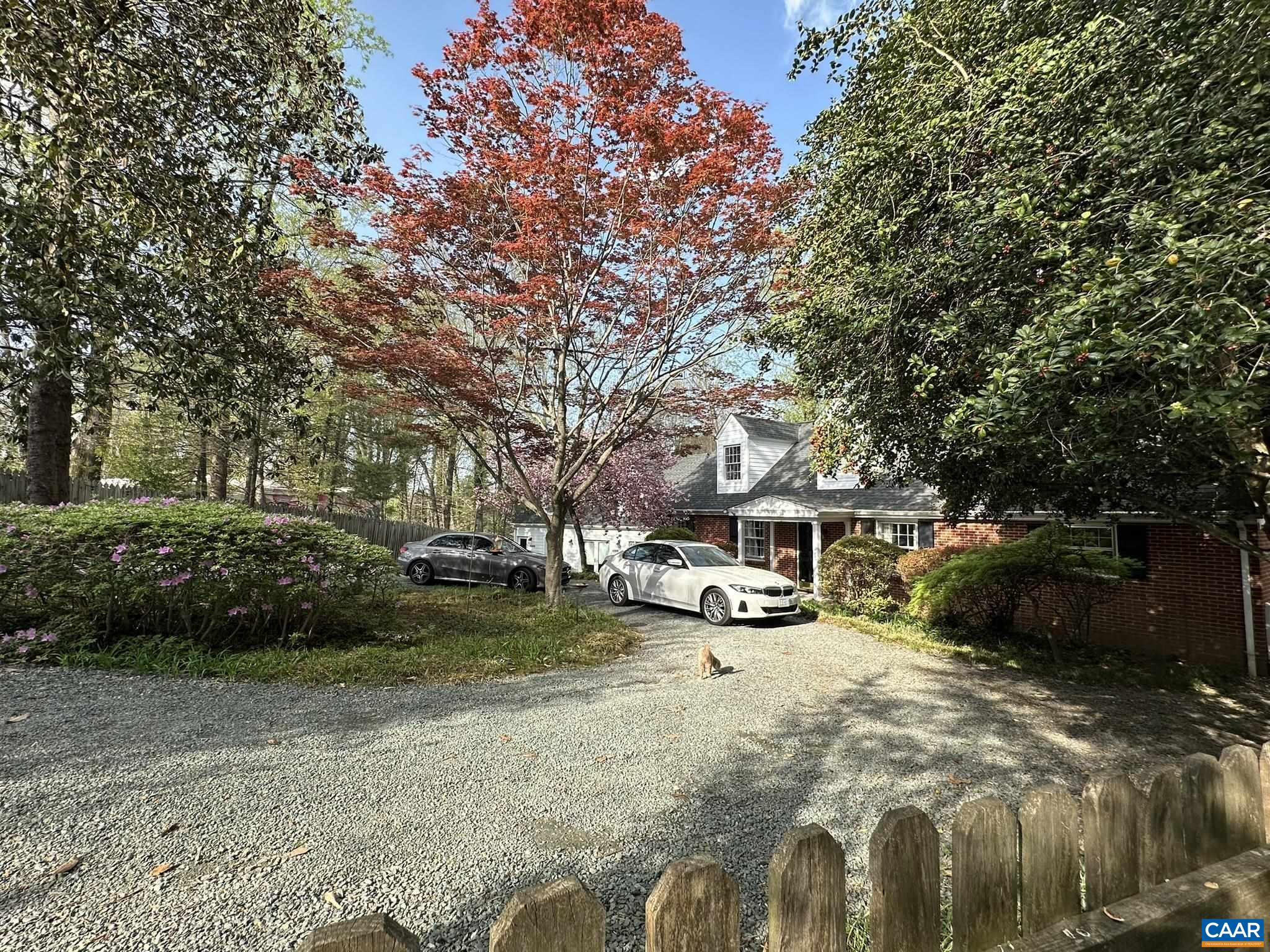 Hidden down a lane near UVA & Barracks Rd shops, find the ultimate in-town compound with privacy & flexible space on .92 acre!  Enjoy nature at home & in the guest house.  This gracious classic compound encourages entertaining both indoors and on 3 decks. Enjoy multiple primary suites, kitchens and bathrooms, three decks overlooking woods, creek & wildlife. Proven high income possible from one or more AirBnBs while living in main house. Great storage, closets & off-street parking.