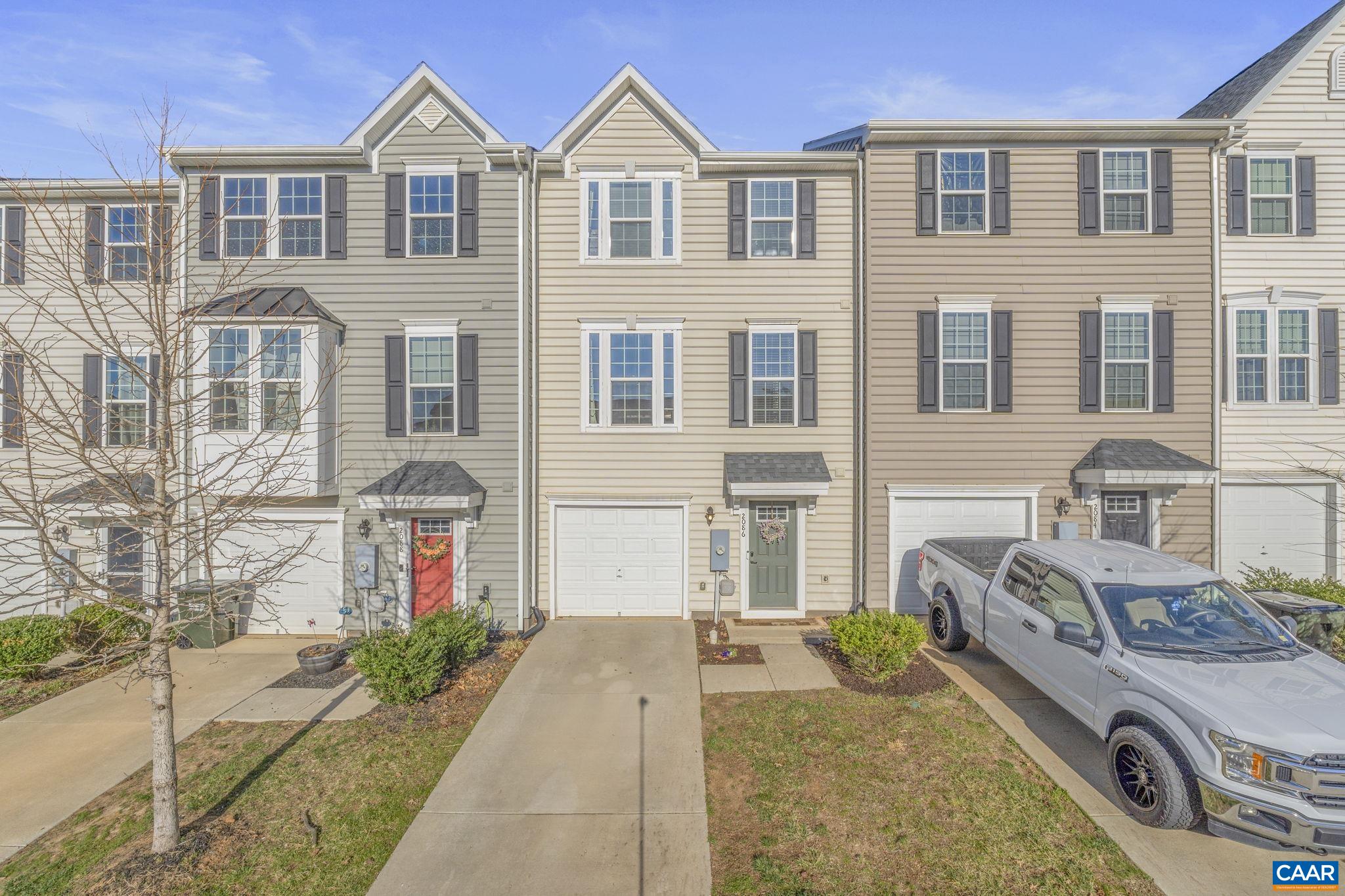 OPEN SATURDAY 3/29 noon - 2:00 PM. Conveniently-located townhome in the Riverwood community in northern Albemarle, minutes to NGIC, CHO, UVA Health and shopping. This home sits on a great lot within the neighborhood with a flat, fenced-in backyard. The main level features an open floor plan kitchen, dining, and living area that feels modern and spacious. The dining and entertaining space is extended with a deck that connects to the backyard. On the upper level, there is generous primary suite with a large walk-in closet and an attached bath featuring a walk-in shower. Two additional bedrooms, a full bath, and laundry area round out the upper level. The terrace level offers a garage, storage, and a great rec space that could serve as a playroom, office, or den. This wonderful home is less than 6 years old, move-in ready, and HERS energy-rated. HOA fee includes front yard landscaping, trash pickup, snow removal, and common area maintenance.