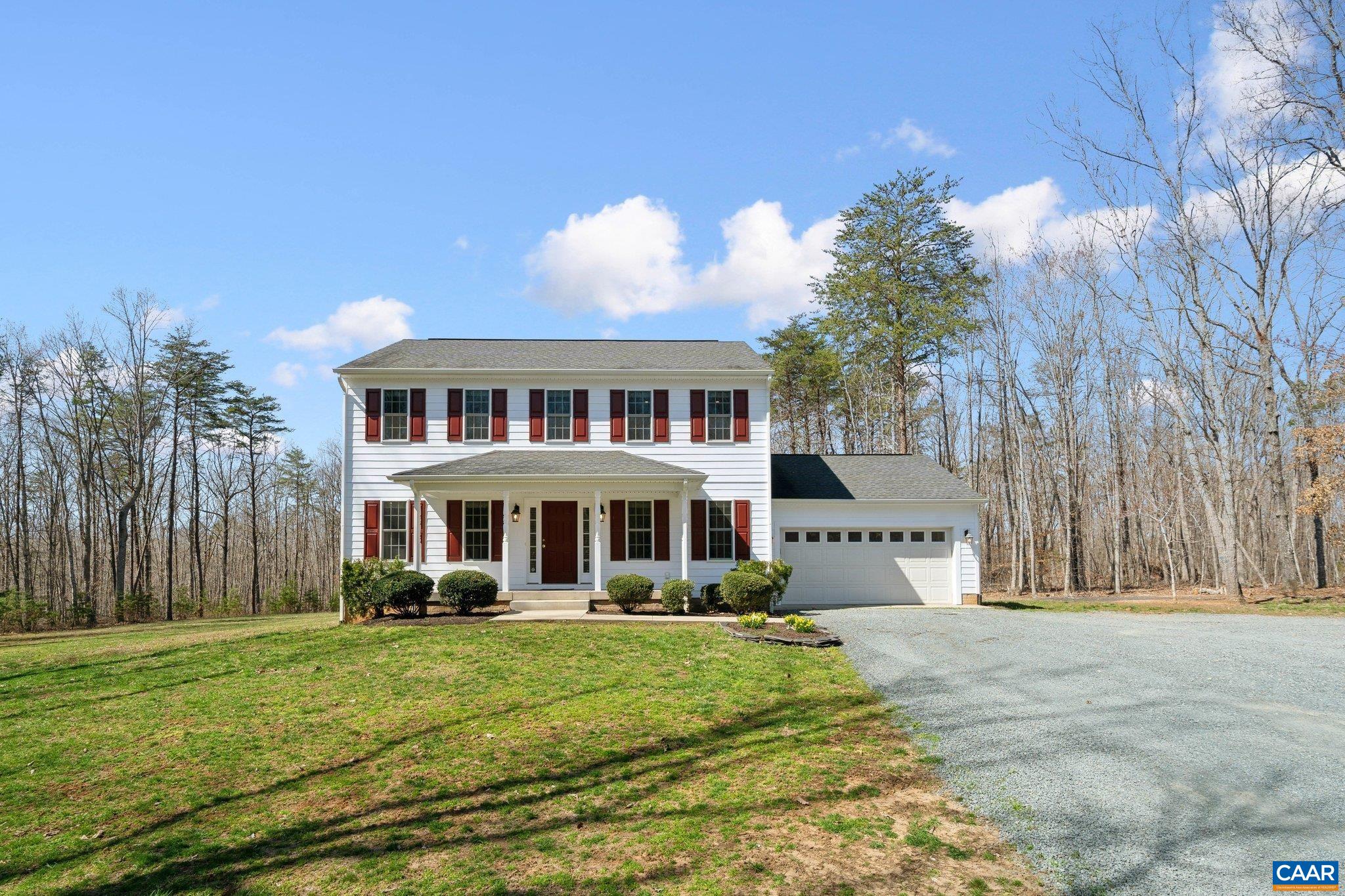 Great opportunity to own a beautiful home sitting on 23 acres, just outside of Charlottesville. This 3,000 square foot, colonial style home was built in 2010 and has 5 bedrooms, 3.5 bathrooms, an attached 2 car garage, and a full walkout basement. There are beautiful hardwood floors, conveying furniture, high speed internet, and an elevated rear deck. The 23 acres consist of wonderful hardwoods with many oak trees. This is a turn key opportunity. Located approximately 25 minutes south of Charlottesville, 5 minutes from Scottsville and the James River, and minutes from the Mount Ida Reserve Winery and Taphouse.