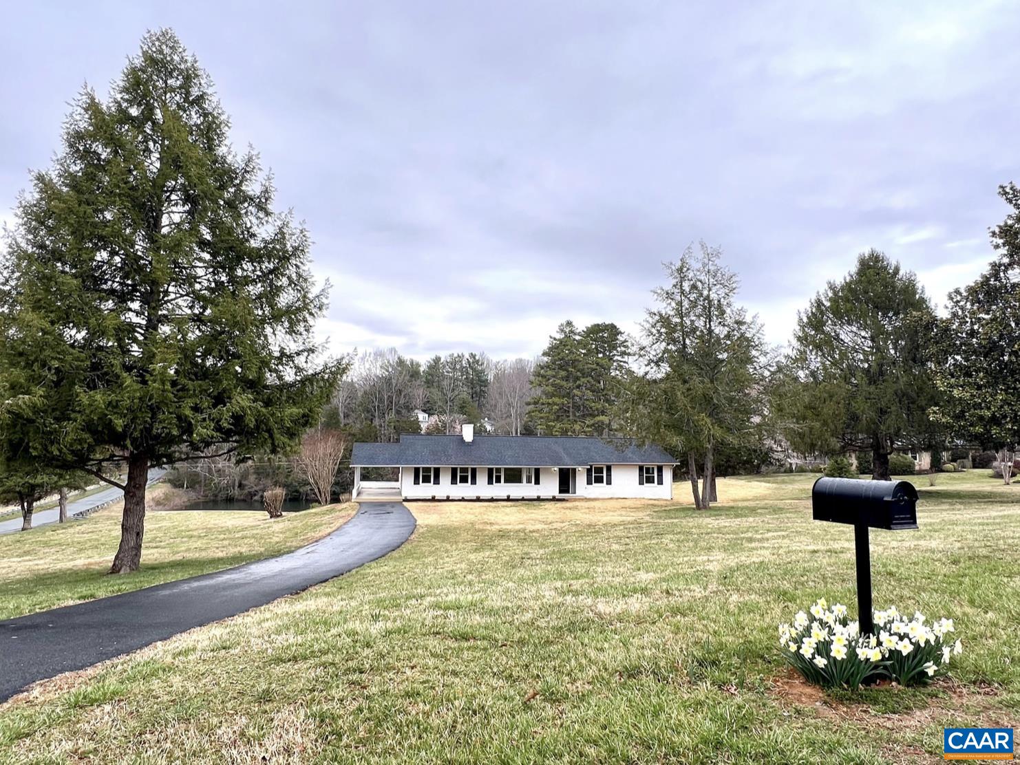 *** $50,000 Price Reduction ***Enjoy generous outdoor space on this 2 acre corner lot with a pond. This could be your sprawling 6 BR 3,770 sq ft home or two totally separate residences with separate meters, kitchens, laundry rooms, water heaters, and paved driveway entrances.Perfect for multigenerational living or rental options. Coveted Key West neighborhood,15 minutes to UVA. Walkable distance to a membership-only community club which includes: heated pool, trails along the Rivanna River with a sandy beach, tennis courts, etc.. No HOA dues. This exceptional custom renovation is a must see. From the complete kitchen and bath creations providing new cabinets and appliances in both, each individually designed with unique fixtures and tile work; the entire home is a real treasure. Construction features include all new: HVAC including ducts, plumbing, windows, roof, and gutters. Insulation in basement walls and ceiling provide temperature and sound barrier. The same attention to detail is applied to the exterior with: limewashed brick, freshly painted exterior trim, 12’ X 40’ deck overlooking the pond, and newly-installed asphalt drive on lower level. See the fact sheet for complete property details.