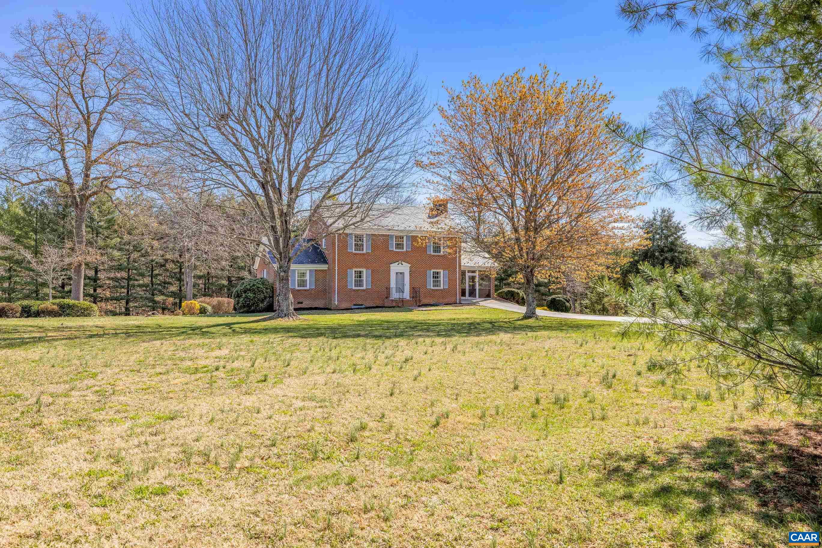 A TRUE COUNTRYSIDE RETREAT! INCLUDING 31+ ACRES with DIVISION POTENTIAL & $50K IN TIMBER & a separate 3 acre parcel across the street. WARMTH AND CHARACTER EXUDE in this TRADITIONAL VIRGINIA BRICK HOME! Nestled in the serene countryside you'll find this quintessential center-hall colonial home with timeless charm & modern conveniences. Featuring solid hardwood floors, newer windows, Buckingham slate roof & brand-new HVAC system in 2024. With generously sized rooms & 2 inviting fireplaces, the interior offers a cozy yet spacious feel. Main-level primary suite includes an en-suite bathroom for added convenience & walk-in closet. Nice sized eat-in kitchen, dining room & living room spaces. Enjoy peaceful country views from the screened porch & large 435 sqft patio, surrounded by established landscape that enhances the home’s picturesque setting. Walk-out terrace level features the 2nd fireplace, a bathroom, & ample storage or workshop space, complete with 2 private exits. Large shed with a concrete pad & electricity—perfect for projects, storage, or hobbies. High-speed internet, generator & tons of paved parking. TONS OF POTENTIAL IN THIS UNIQUE​​‌​​​​‌​​‌‌​‌‌‌​​‌‌​‌‌‌​​‌‌​‌‌‌ OFFERING!