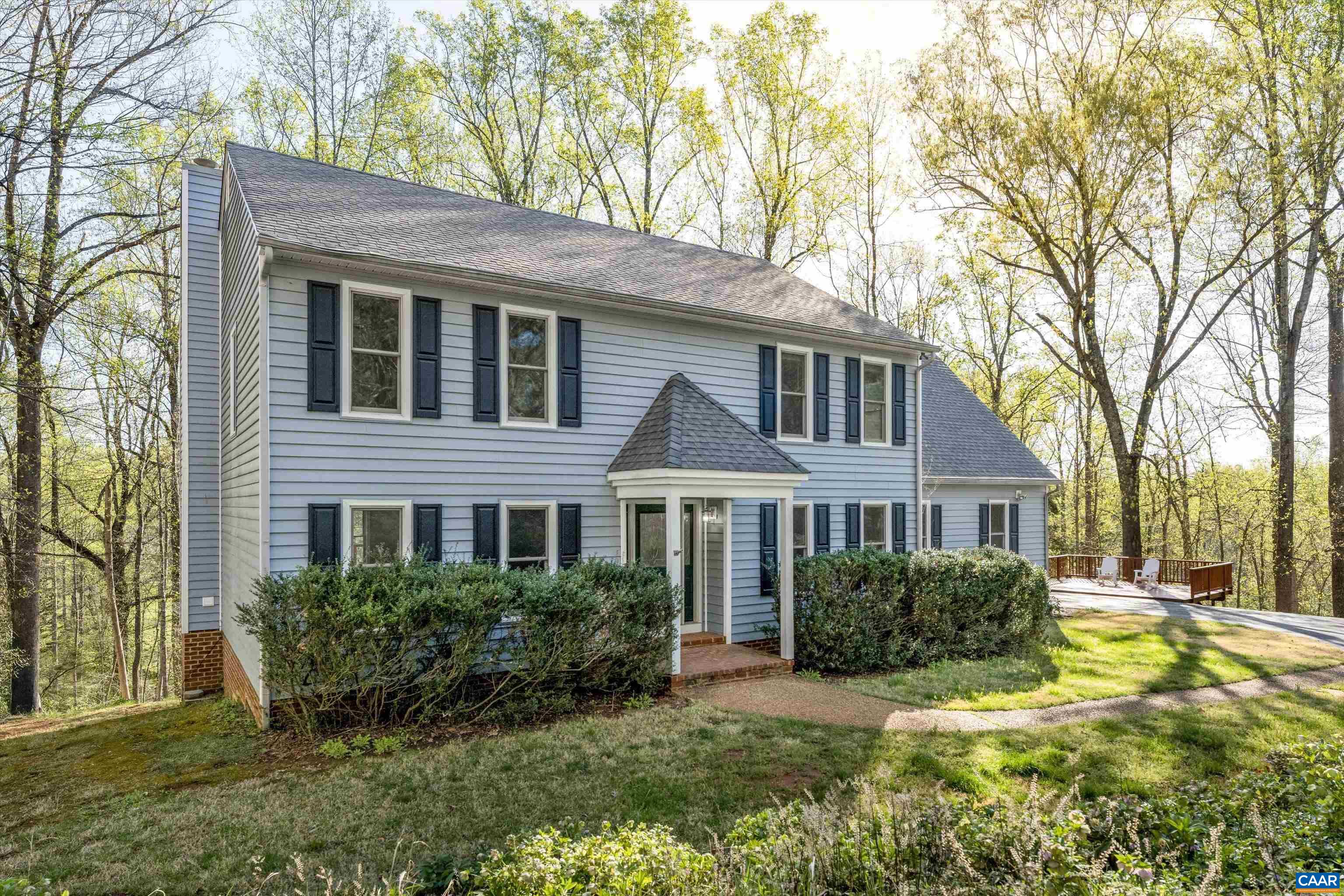 PRIVATE IVY RETREAT IN HIGHLY SOUGHT-AFTER WESTERN ALBEMARLE! This stunning 5 bedroom, 3.5 bath home offers nearly 4,000 square feet of living space on a beautifully landscaped 3.17 acre lot. Enjoy quick access to Ivy Elementary, Blue Ridge Swim Club, and Duner's while being only 15 minutes to UVA and Downtown Charlottesville. The spacious eat-in kitchen features stainless steel appliances, custom cabinetry, granite countertops, and a butler’s pantry, with easy access from the kitchen to an expansive deck overlooking the private yard. Enjoy cozy evenings by one of the two brick fireplaces in the living room or basement. The primary suite boasts skylights and a bathroom with dual vanities. A dedicated home office provides the perfect space for remote work or study. Additional highlights include a large laundry room, a full finished walk-out basement, and a patio. Recent improvements include new LVP flooring on main level, new carpet upstairs, and interior paint throughout the home. This private retreat offers the perfect balance of space, comfort, and tranquility. Schedule your showing today!