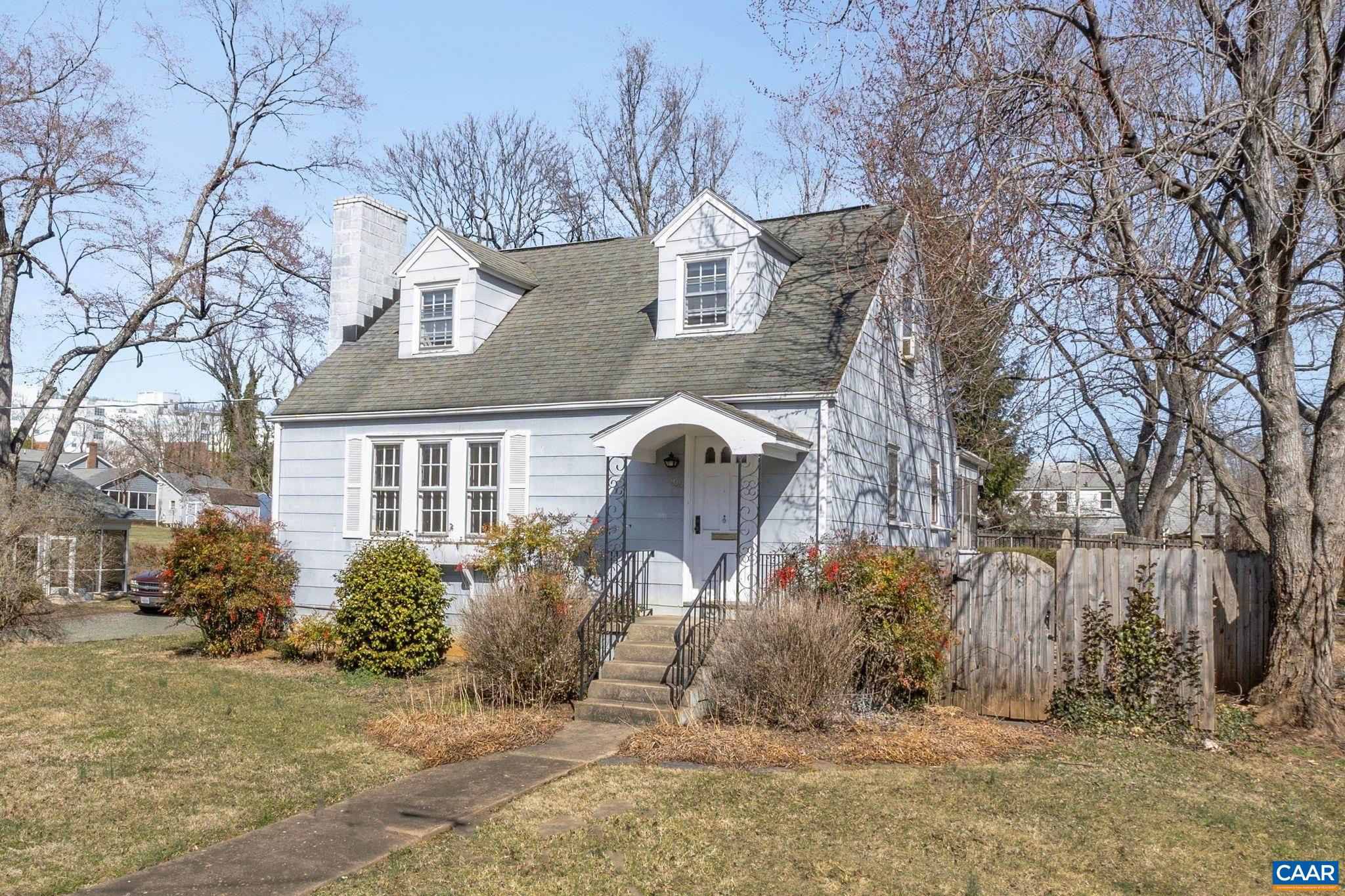 Nestled atop a sunny knoll in the highly sought-after Fifeville neighborhood, this delightful 3-bedroom, 2-bath Cape Cod blends timeless character with exciting potential. Just a short jaunt to the University of Virginia, the Downtown Mall, & an array of charming shops & restaurants, this gem offers the best of Charlottesville living. Surrounded by mature trees, the home features hardwood floors, a cozy fireplace in the living room, & a freshly painted interior that feels both bright & welcoming. The eat-in kitchen nook & sun-drenched enclosed rear porch provide perfect spots for morning coffee or quiet reading. Downstairs, you’ll find a spacious walkout basement with its own entrance. Whether you envision a guest suite, home office, or rental unit, there’s plenty of room to make it your own. Architectural plans for an elegant renovation are included, helping to bring your dream home—or investment property—to life. Bonus features include ample free off-street parking & generous basement storage. The property is zoned R-B & eligible for expansion. With an adjacent .14-acre lot also available, each offer the option to build up to 6–12 multi-family units or to create a spacious compound with room to grow, play, & entertain.