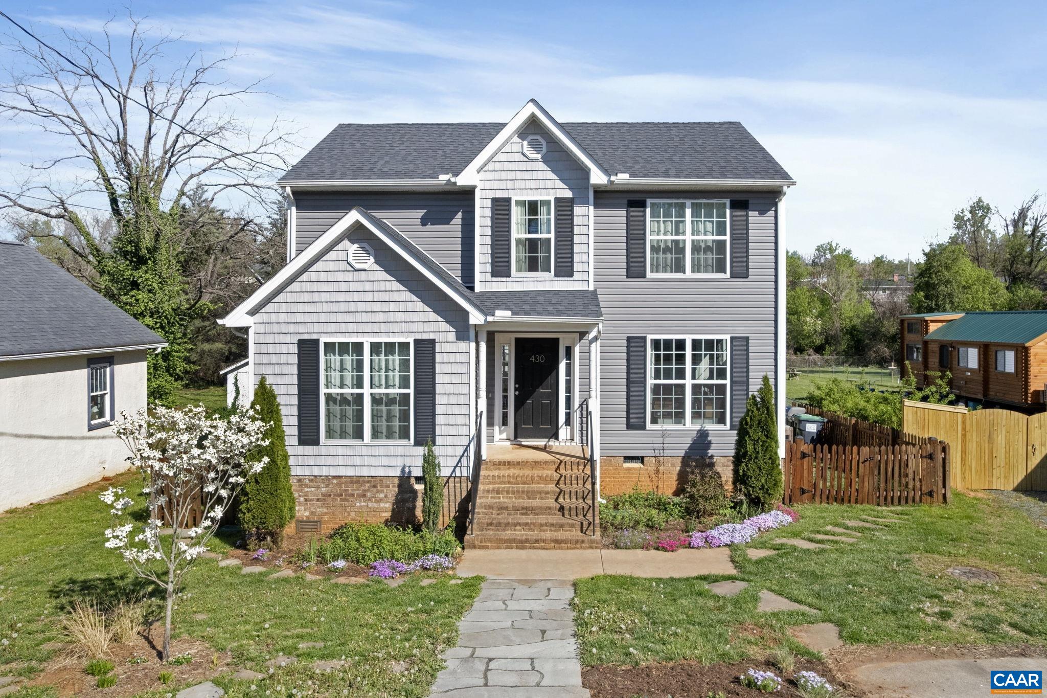 OPEN SUNDAY JUNE 8, 2-4PM.  Built in 2019 (a true rarity in the City of Charlottesville) this 4-bedroom, 2.5-bath home offers the best of both worlds: modern construction in an established, walkable neighborhood. Located in the vibrant Woolen Mills area, just a 2-minute walk to Meade Park and Onesty Pool, this home combines convenience, function, and style. The layout is refreshingly sensible, featuring a main-level primary suite, light-filled living spaces, and 3 additional bedrooms upstairs. Thoughtful landscaping with native plants adds beauty and ecological value to the front yard, while the flat, fully fenced backyard is ideal for pets, play, or gardening (another rare find in the city.) A 5.6kW solar panel system on the roof (fully paid off) provides major energy savings, with nearly $0 electric bills during the summer months and minimal bills in the winter. It’s a smart, sustainable upgrade that adds real long-term value! Set within easy access to Downtown, the Rivanna Trail, and local favorites like the Downtown Mall, markets, and restaurants, this home is a standout opportunity in one of Charlottesville’s most dynamic neighborhoods.