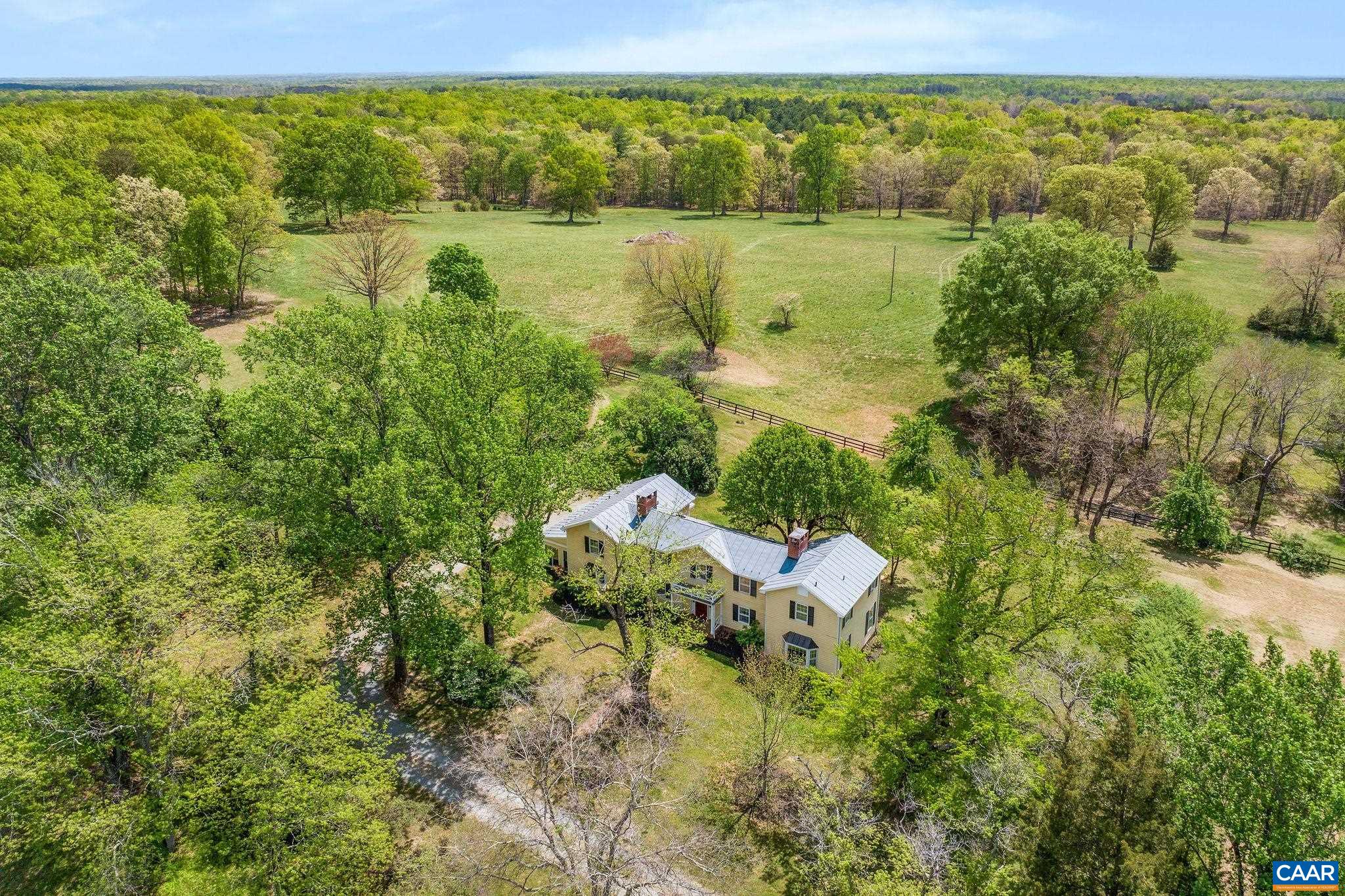 On the market for the first time in nearly 50 years, this remarkable 130-acre property offers a rare opportunity to own a diverse and scenic piece of Central Virginia. Spanning 2 distinct parcels, the land features rolling pastures, hardwood forests, two ponds, & breathtaking views of Southwest Mountain—all anchored by a  picturesque c. 1900 farmhouse. Perfectly suited for horses, cattle, hay, or even a vineyard, the property is an excellent candidate for conservation easement. Surrounded by protected farms and estates, it offers both privacy &  long-term preservation potential. The character-rich farmhouse could serve as a primary residence, weekend retreat, or guesthouse—leaving open the option to build on one of several exceptional homesites with mountain views. Additional improvements include a 2nd home overlooking a pond, a small barn, an equipment shed, & gently rolling acreage ready for agricultural or recreational use. Located in a region rich with history and natural beauty, this special offering is priced $400,000 below the 2025 assessment—an incredible value for land of this caliber. Just 25 min to Charlottesville, 1 hr to Richmond, 2 hrs to D.C., and only moments to the conveniences of historic Gordonsville.