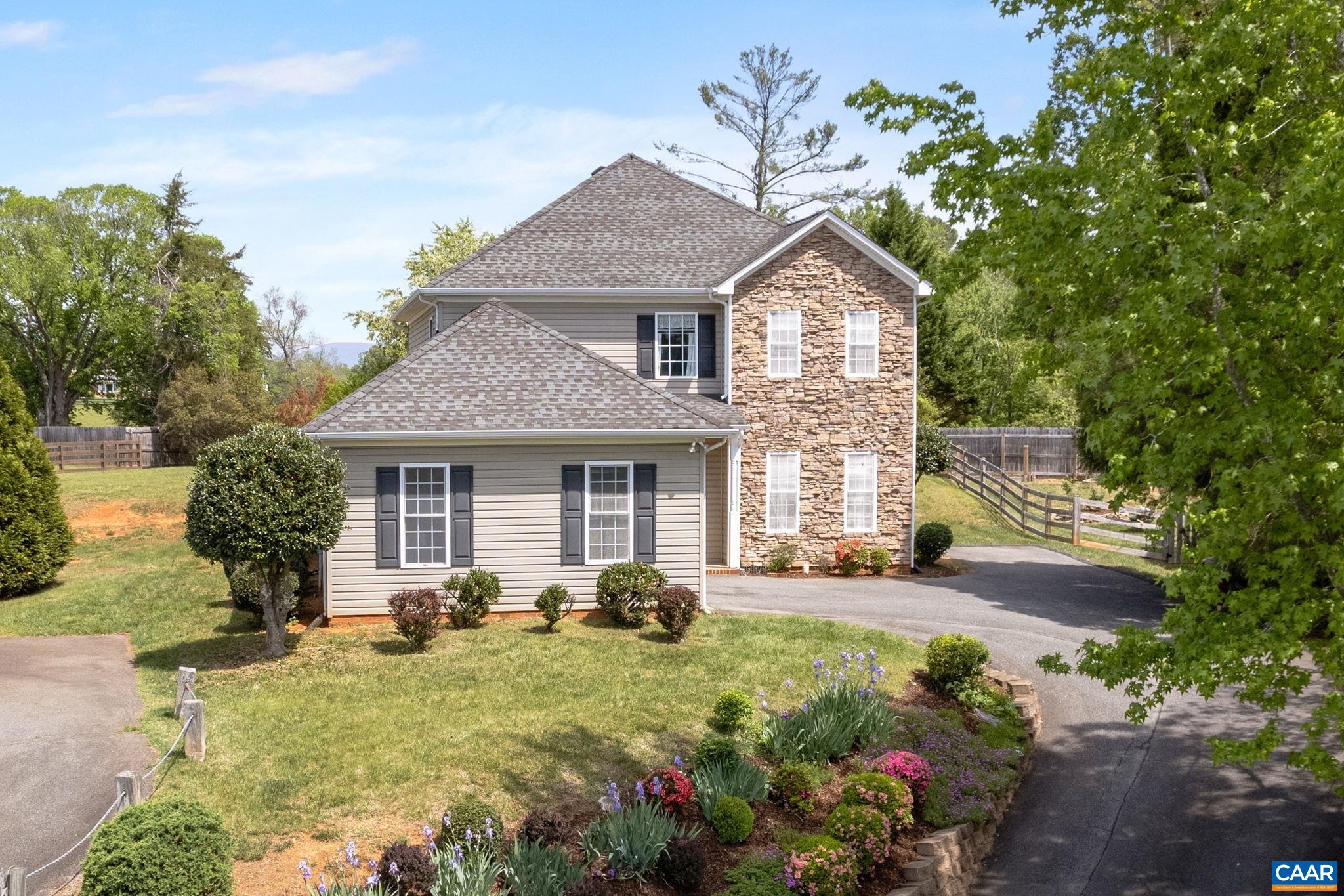 Open House Saturday, 5/24 12-2pm! This private 4 bed, 2.5 bath home in the HIGHLANDS neighborhood boasts MOUNTAIN VIEWS, 9' ceilings, an UPDATED KITCHEN (2023) featuring white cabinets and Granite countertops, newer appliances and faucet, large eat-in and dining room areas and WALK-IN PANTRY, PRIMARY SUITE with tray ceilings, WALK-IN CLOSET and ENSUITE BATH with a spa-like jetted soaker tub and glass shower! Other notable improvements and features include: FRESH PAINT THROUGHOUT, UPDATED BATHROOMS, NEW LVP UPSTAIRS, newer hot water heater, large bedroom closets, gas fireplace, and two heat pumps. Host friends in the spacious SUNNY TIERED BACKYARD; park your car in the ATTACHED 2-CAR GARAGE; enjoy the CONVENIENCE of living just 3 minutes from BEAVER CREEK RESERVOIR & PARK, 5 minutes from Crozet's historic downtown, and 15 minutes from Charlottesville/UVA! HOA includes trash pickup, snow removal and all yard maintenance out front!