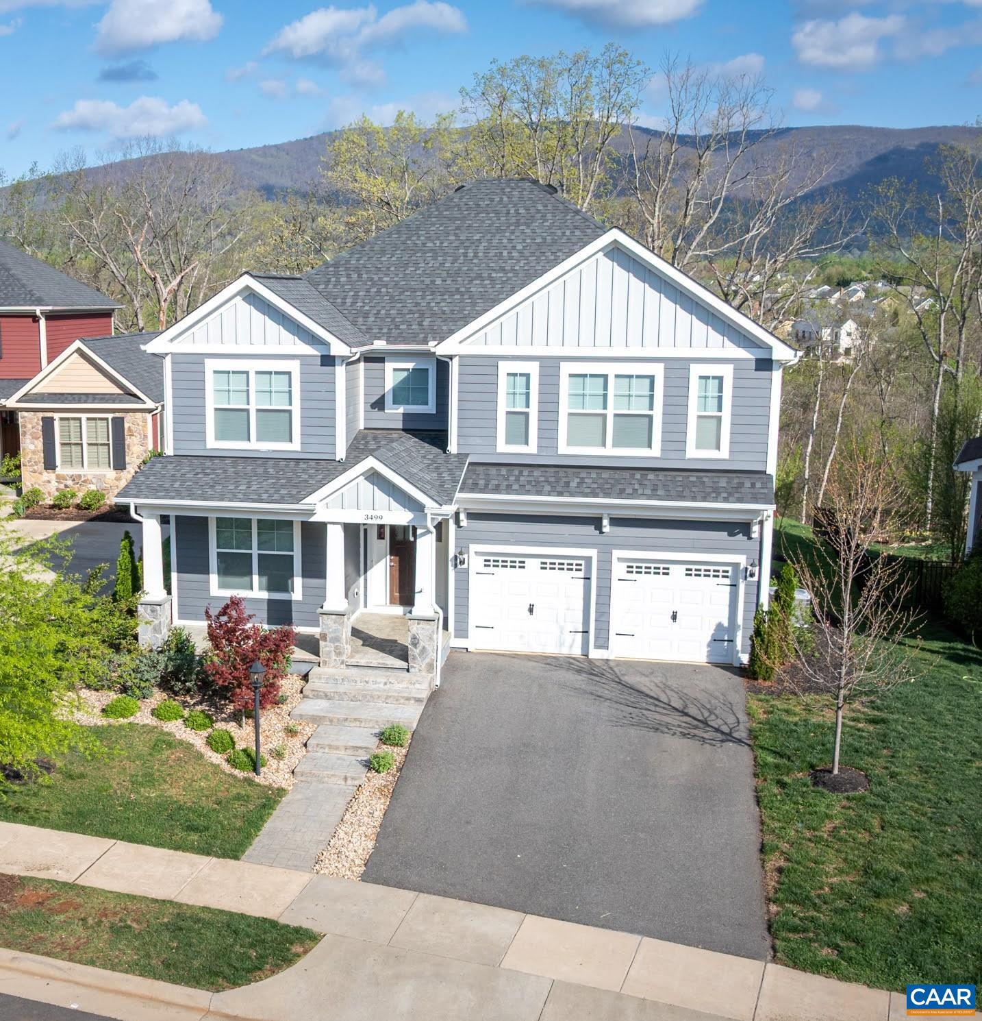 OPEN SUN, 5/18 12-2! Welcome to this stunning home with a VIEW in the heart of everything! Seasonal views of the Blue Ridge Mountains from every window in rear of home. Move right in without the wait / cost of new construction. The front porch beckons you to relax and visit w/ neighbors. Wonderful open concept layout will be sure to please! Dedicated home office w/ shadow box molding. Welcoming living room w/ gas fireplace as the focal point. Sunny dining area off charming screened porch. Chef's kitchen w/ stainless GE appliances, exquisite granite counters and island w/ breakfast bar. Awesome mud room off 2 car garage. Attractive, durable LVP flooring throughout main level. Upstairs boasts a lavish primary suite + 3 bedrooms w/ walk-in closets & ensuite baths. Terrace level offers a 5th bedroom, 4th bath, an outstanding media/rec room + a great storage room. The "piece de resistance" is the GORGEOUS patio w/ built-in hot tub! Entertain friends & family and bask in the magnificent sunsets and glorious sounds of nature. Life as it's meant to be lived! Backs to Old Trail Park and Lickinghole Creek. Stroll to Old Trail Village, pool, golf, play area, downtown Crozet & three schools. Short drive to hiking trails, breweries & wineries.