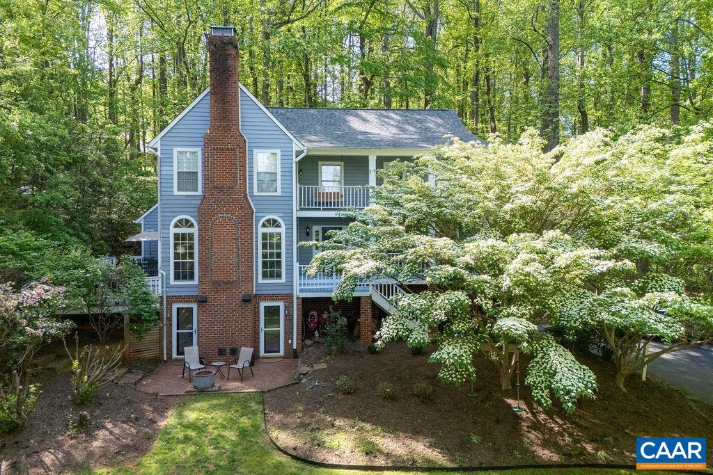 Set in the tranquil, wooded Ashcroft neighborhood, this spacious custom home offers warm, inviting living in a peaceful setting with seasonal mountain views. The freshly painted main level flows comfortably through the dining, kitchen, and family areas, and includes a formal living room with new custom built-ins. At the heart of the home, the kitchen features a large island ideal for gathering, along with new granite countertops, cooktop, wall oven/microwave combo, and dishwasher. Upstairs, the spacious primary suite offers a private retreat with ample room, while the additional bedrooms are generously sized and filled with natural light. The walk-out terrace level includes built-ins and a full bath—perfect for a guest suite, home gym, office. Enjoy outdoor living on two front decks (one off the primary suite) and a serene side deck ideal for dining among the trees. The low-maintenance landscaping blends beautifully with the natural surroundings. With a new roof, new washer/dryer, and access to Ashcroft’s miles of trails, pool, and clubhouse, this home offers the best of mountain living just minutes from town.