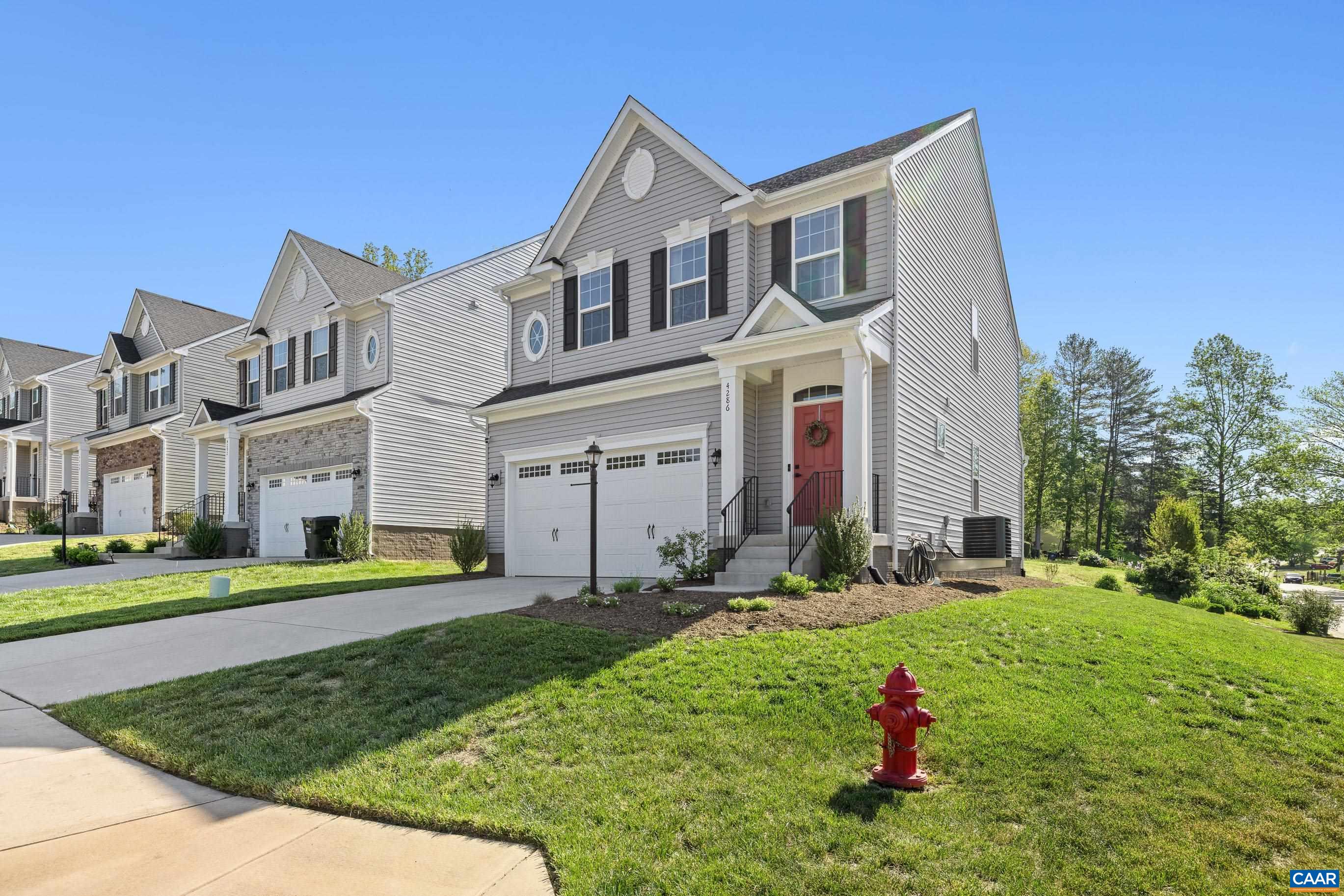 This MOVE-IN READY 3-bedroom, 2.5-bath home offers a bright, open-concept kitchen and living space that is ideal for everyday living! The kitchen has beautiful white cabinets and a LARGE KITCHEN ISLAND for entertaining! Enjoy UPDATED FLOORING in the living room and in the two additional bedrooms upstairs, complemented by FRESH PAINT throughout the entire home. The spacious primary suite features TWO LARGE WALK-IN CLOSETS and DUAL VANITIES! The UNFINISHED basement offers excellent potential for expansion, already ROUGHED IN for a full bathroom. Step outside to a newly added STONE PATIO with a sitting wall, ideal for relaxing or hosting, plus a NEW SHED and TERRACED LANDSCAPING lining the back of the property. The house sits at the end of the street so you have a CORNER LOT for more privacy and across the street from the NEIGHBORHOOD PARKS and only 5 mins to the Airport and Hollymead Town Center (Target, Harris Teeter) and 20 mins to Downtown C'ville!