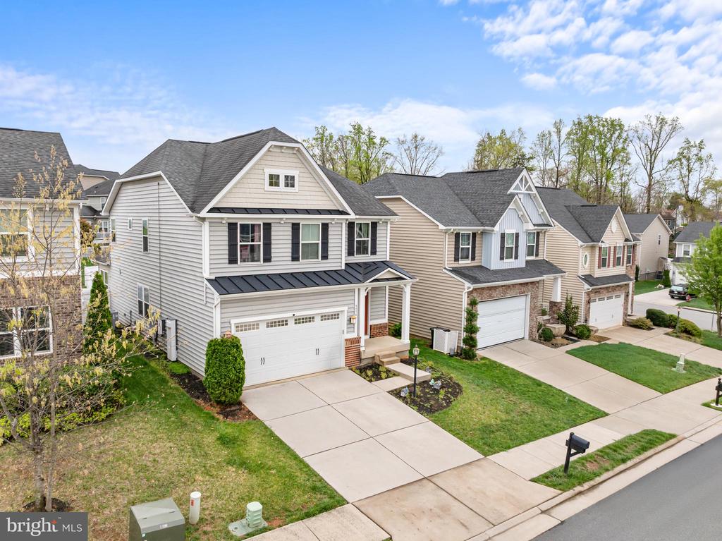 Welcome home to this gorgeous craftsman home in very desirable Charlottesville location. With 3 fully finished levels and over 3200 finished sq. ft. this home has abundant space to accommodate all your needs. ***SOLAR PANELS convey with the house. These will be owned and not leased. The main level features an inviting front porch into a nice foyer with hardwood floors, oak stairs with decorative iron railing, formal dining room , large family room. The gourmet kitchen features walk in pantry, stainless steel appliances, double ovens, cooktop, microwave, center island, granite counter tops and tile backsplash. There is a nice additional morning room right off the kitchen leading to fully fenced rear yard, paver patio and trex landing. The upstairs features primary bedroom with tray ceiling, walk in closet and deluxe bath with soaking tub, oversized seperate shower, vanity with double sinks, and additional walk in closet.The additional three bedrooms are large size and all have ample size closets. Upstairs laundry room with washer and dryer that convey. Secondary Bath has large linen closet and tub/shower. The fully finished lower level has large finished rec room space, additional playroom/theatre room, full bath, french door to wa