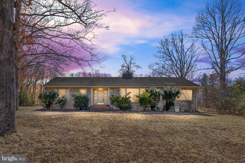 Nestled on a spacious 3.6-acre property spanning two lots with road frontage on two roads, this well-maintained 4-bedroom, 4-bathroom stone ranch offers timeless charm and incredible potential. With over 2,500 square feet of finished space, a full basement, and a 2-car garage, this home provides ample room to spread out and make it your own. Step inside to find a warm and inviting living room with a fireplace, perfect for cozy nights. A second fireplace in the basement adds even more character and potential for additional living space. The home has been lovingly maintained, preserving its vintage charm while offering a solid foundation for modern updates. Outside, enjoy the expansive yard, ideal for gardening, outdoor activities, or simply soaking in the peaceful surroundings. The large 2-car garage provides plenty of storage and convenience, while the property's unique layout offers flexibility for future possibilities. Located in a prime Scottville location, this home offers the best of rural tranquility with convenient access to local amenities. Don't miss this rare opportunity””schedule your showing today!