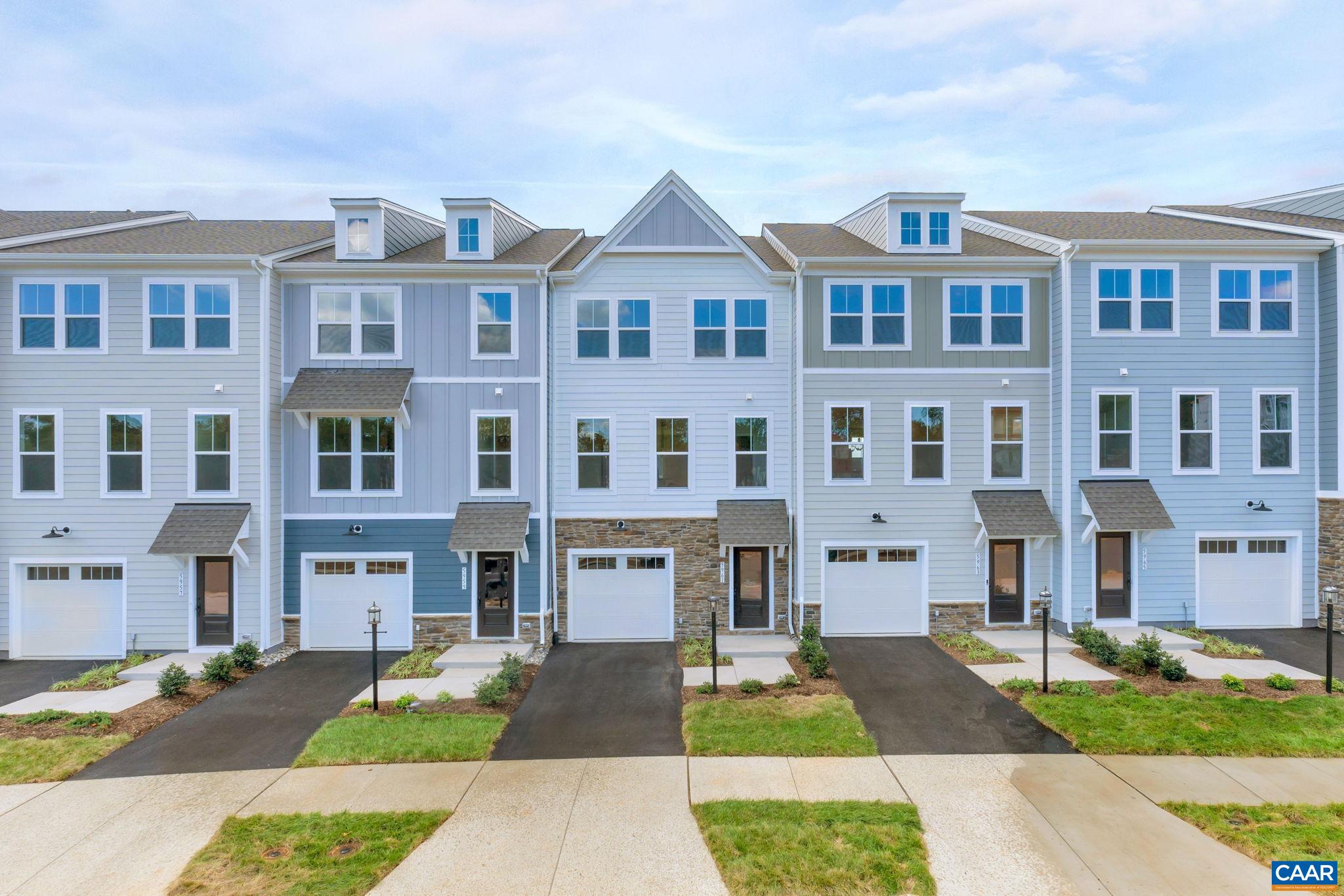 Explore the Lucas townhome at Pleasant Green—no rear neighbors and an oversized 1-car garage—with an estimated Aug/Sept 2025 completion. This 3-bed, 2.5-bath home features three finished levels of thoughtful design and everyday function. The entry-level flex space can be a home office, gym, or extra living area, with interior garage access. The main level offers open-concept living with LVP flooring, a spacious living room, and a well-appointed kitchen with GE® stainless appliances, quartz counters, a large island, and a dining area that opens to a private rear deck—ideal for outdoor living. Upstairs, the primary suite includes a walk-in closet and private bath with dual vanities. Two additional bedrooms, a full bath, and bedroom-level laundry complete the upper level. Exterior features include low-maintenance Hardie® siding, HOA-maintained lawn care, and new home warranty coverage. Community amenities include fire pits, a renovated clubhouse, playground, and walkable access to shops, dining, and Crozet’s scenic trails and mountain views. Photos are of similar homes; some images may be virtually staged.