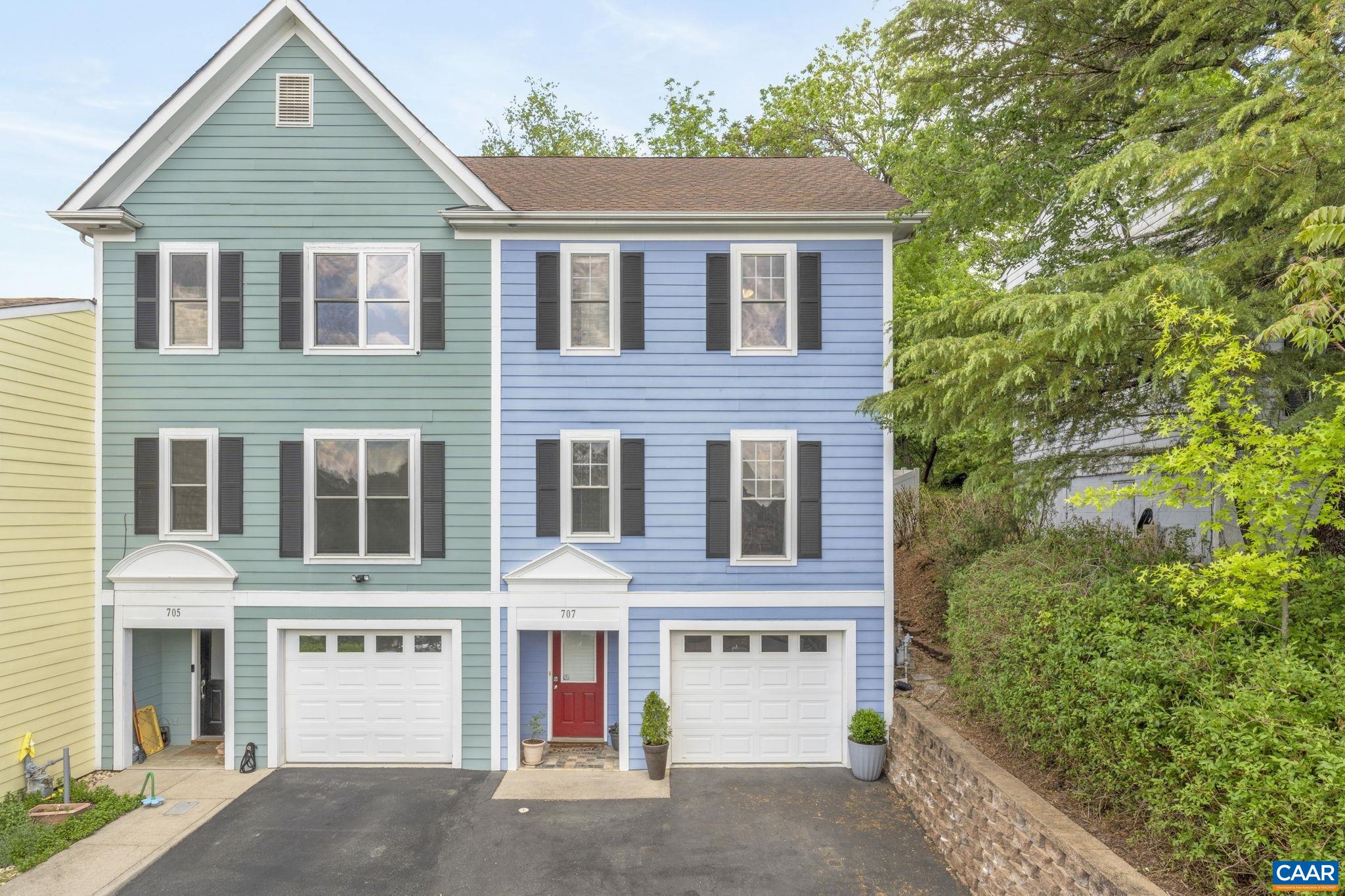 Stylish & light-filled, this 3-level "duplex"-style townhome offers mountain views, no HOA, & a thoughtful design. Built in 2005, it features 2 spacious bedrooms - the primary with an en suite bath & mountain views. The second has a full bathroom just next door. Don't miss the half baths on both the main & entry levels. The main floor boasts 9' ceilings, abundant natural light & a centrally located kitchen ideal for everyday living & entertaining. Enjoy the beautifully landscaped, fully fenced backyard with a deck, perfect for outdoor dining or relaxing. An oversized one-car garage offers a work bench & additional storage. And don't miss the bonus space in the multi-purpose room on the entry level with laundry. Two additional parking spaces out front add convenience to this well-appointed home. Incredibly convenient to the Downtown Mall (1 mi), Wegmans at 5th Street Station (1.4 mi), & UVA Hospital (1.6 mi).