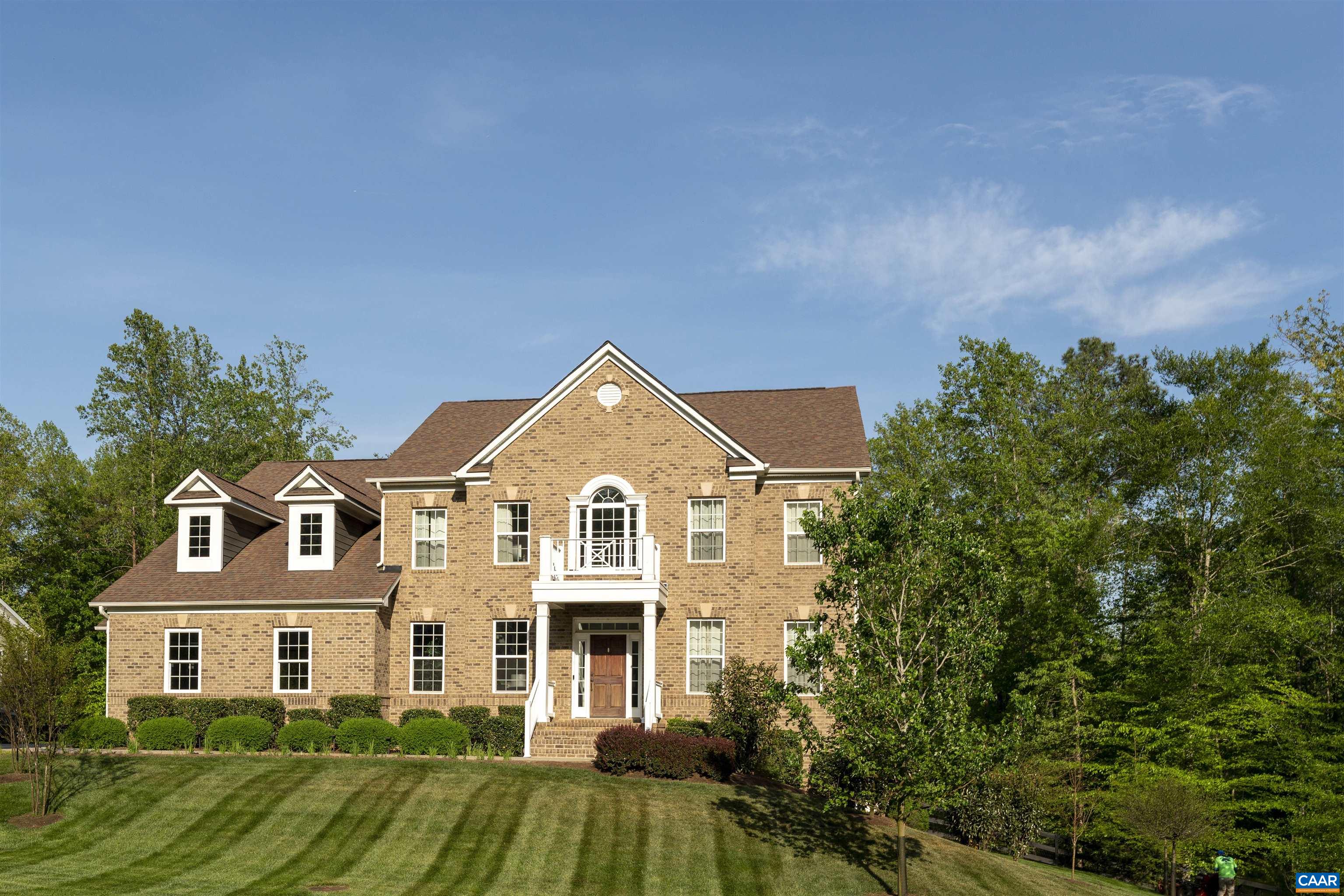 This Whittington custom home offers a bright and airy kitchen, showcasing white cabinetry w/ pull-out wooden shelves, Quartz countertops,  oversized island, spacious walk-in pantry with custom shelving, Stainless steel appliances, a built-in wine cooler, and a charming butler’s pantry/bar with wood countertops. The kitchen seamlessly flows into the family room where one can step out onto a large deck that overlooks one of the most desirable lots in the neighborhood. The flat, fenced-in backyard, surrounded by serene woods for added privacy, boasts an underground sprinkler system. Upstairs, you’ll find 4 spacious bedrooms and 3 full bathrooms, including the primary suite. The primary bedroom features a  sitting area, an expansive spa-like bathroom w/ upgraded marble tile, and a custom California closet. The  finished basement offers a dedicated home theater room, as well as room for a game area, home gym, or office. Pre-plumbed and wired for a wet bar or kitchenette, this expansive basement also includes a full bathroom, and a bedroom. Sliding doors lead to an extended stone patio for additional outdoor entertainment space.Plus, the property backs up to scenic trails, Conveniently located near downtown, UVA, Fifth Street Station.
