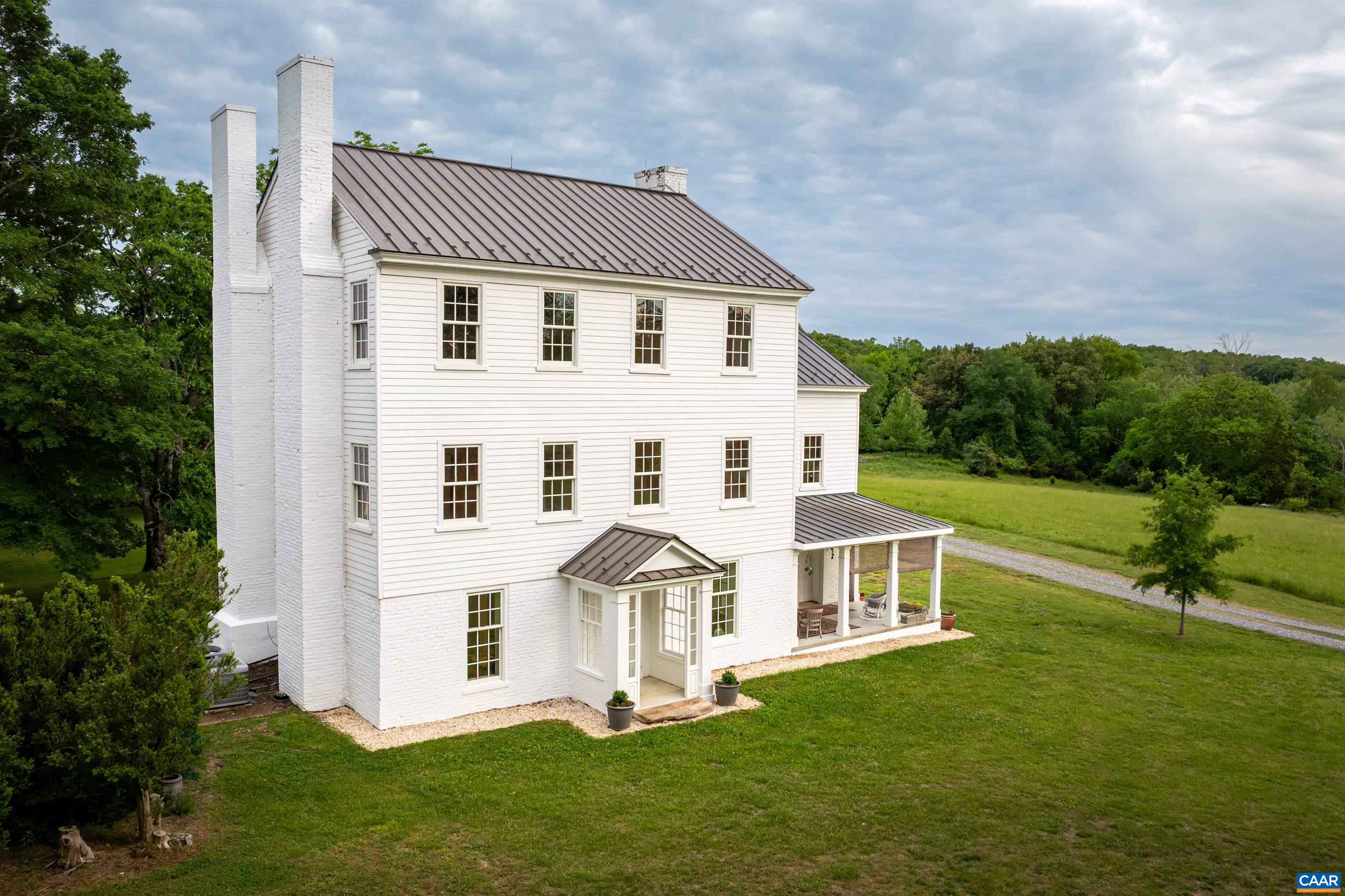 This is a rare opportunity to acquire a historic farmstead in rural central Virginia that is sure to enchant for generations to come. Long known by locals as "the Springs", the story of this property is rooted in centuries of Morris Family ownership. It was made famous in the 1800s by the enterprising Samuel Morris who operated a successful health resort called Buckingham Springs, where guests partook in the purported healing benefits of the local mineral spring water. While the hotel and cottages are long gone, the 4-story structure k/a The Morris House (c. 1810) stands renovated (2011) to modern standards, ensuring an elegant home w/ historic appeal & present day conveniences. There is ample room whether you enjoy a simple family meal in the spacious eat-in kitchen or entertain VIPs in the formal living spaces. Level 1 further offers a laundry room (plumbed for half bath), a full bath with walk-in shower, 3 FPs, a cozy den with built-ins, and a small home office that could serve as a first floor bedroom. Levels 2 & 3 boast the primary BR w/ensuite bath, 5 additional BRs and 2 more full baths. Fully conditioned, walk-up attic on Level 4 for storage or make it an artist's studio!