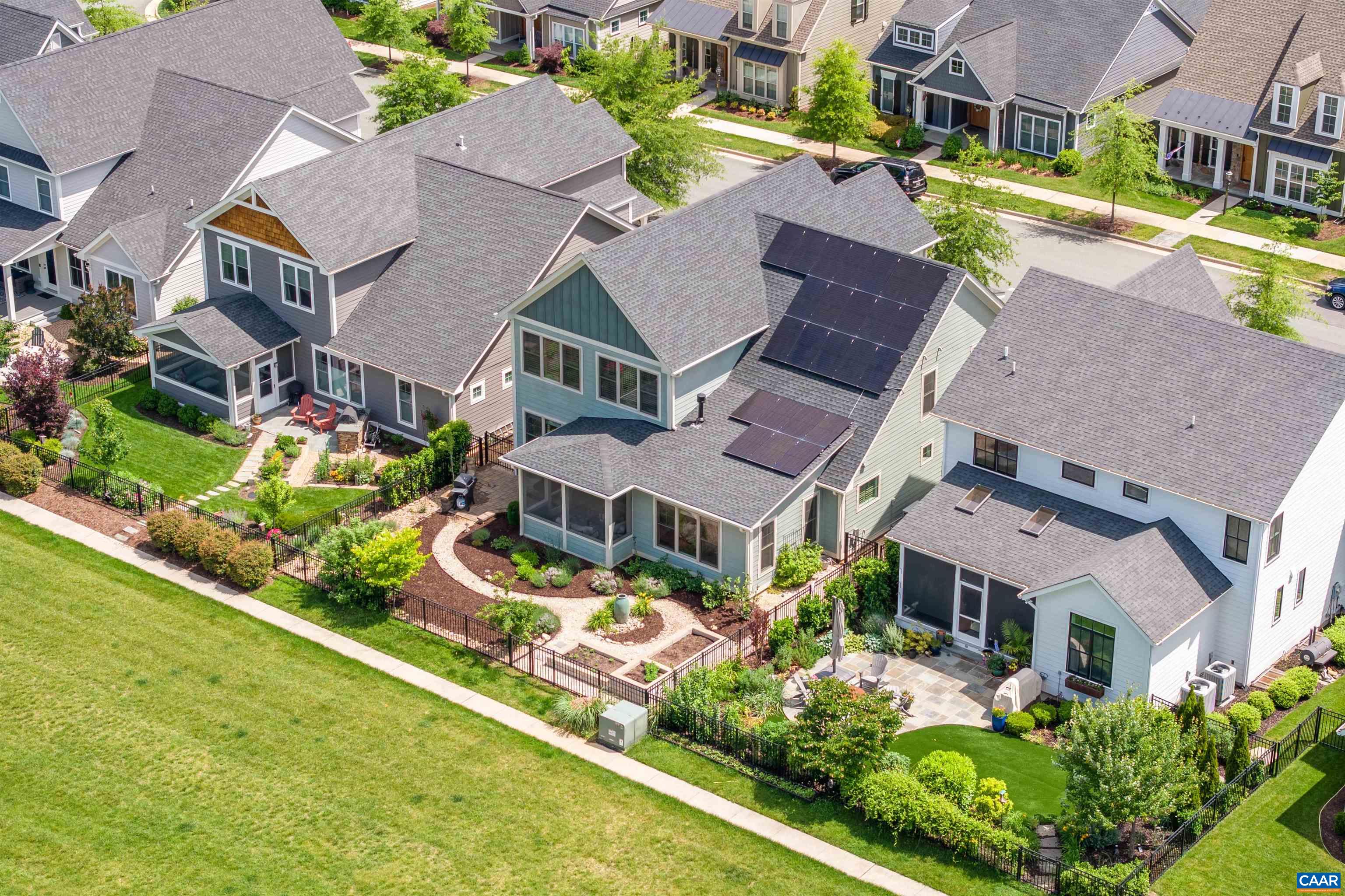 Built in 2019 as the builder’s model home, this beautifully crafted 5-bedroom residence in the heart of Old Trail features main-level living, high-end finishes, and a prime location that backs to green space with mtn views. Enjoy the ease of main-level living with a generously sized first-floor primary suite. Upstairs, you'll find an office loft with built-ins, 3 additional bedrooms, 2 luxe baths and a 19x27 bonus room with flex uses such as a 5th BR,  2nd floor family room/playroom, office or storage. The well-appointed kitchen features a Wolf cooktop, built-in side bar, an enviable walk-in pantry & large Pella windows to bring in the natural light.The fenced yard is a landscaped retreat, including raised planting beds with gate opening to common-area green space—perfect for play and recreation without the upkeep of a large lawn. Enjoy low energy costs with solar panels, a whole-house generator & high-efficiency HVAC. Conveniently located near walking trails, schools, shops, dining, a community pool, and a golf course. A fantastic opportunity to own a beautifully crafted home in a sought-after neighborhood known for its community atmosphere and Western Alb schools.