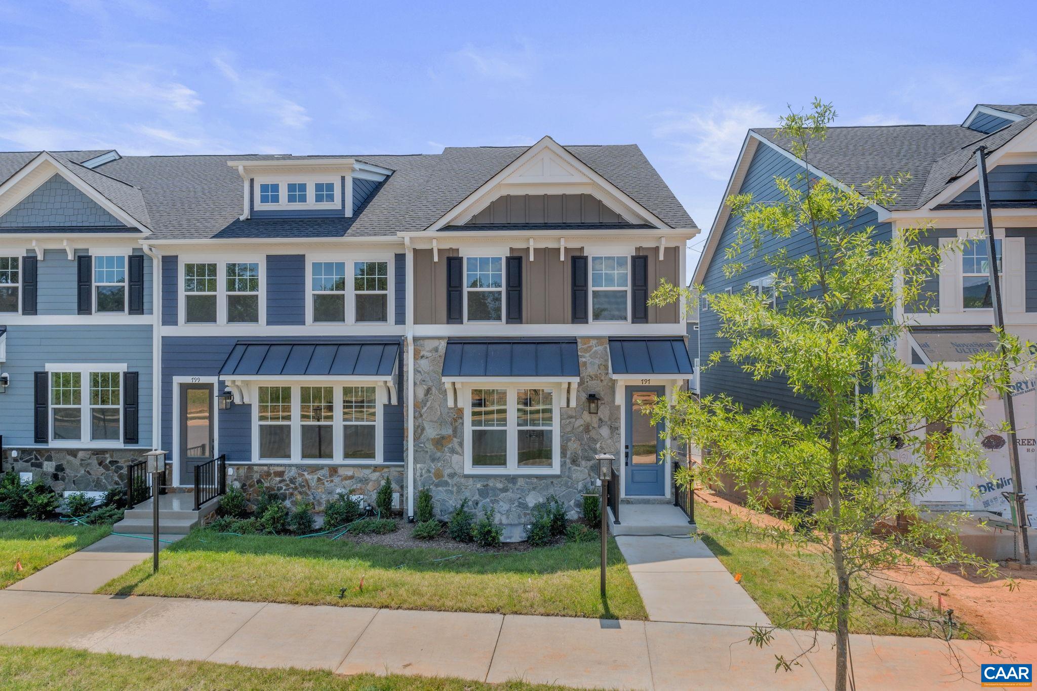 Move-in ready and full of natural light, this Dogwood end-unit townhome offers a scenic setting in Glenbrook with Blue Ridge Mountain views and nearby parks and trails—all just minutes from downtown Crozet. The layout includes two finished stories plus a basement with a flexible rec room, a half bath, and a rear-load two-car garage. The main level features an open-concept kitchen with a large center island, walk-in pantry, and stainless steel appliances, all framed by upgraded cabinetry. Upstairs you’ll find the primary suite, two additional bedrooms, a full hall bath, and a conveniently located laundry area. Details like oak stairs, solid core doors, wood shelving, upgraded trim, and an energy-efficient furnace reflect quality throughout. The home is also located close to a walking path to Crozet Park and has direct access into downtown from the community. Tot lot is just down the block. Actual photos.