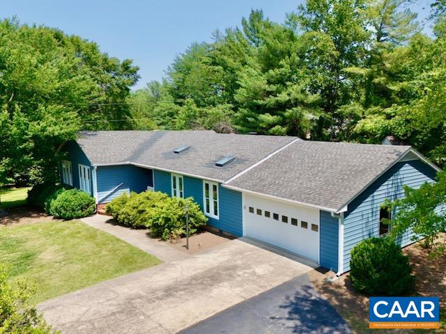HIGHLY UPGRADED, UNBEATABLE LOCATION This home is nestled on a lush .86 acres framed by evergreens in EARLYSVILLE. Beautifully renovated residence boasts extensive upgrades and offers generous space all on ONE LEVEL. Enjoy bright interiors thanks to MULTIPLE SKYLIGHTS throughout home. Stunning kitchen featuring ample counter and cabinet space, stainless steel appliances, granite counters, and soft-close cabinetry. All bathrooms have been updated with new flooring, primary bath features gleaming ceramic tile. Pocket doors allow privacy if wanted from kitchen to dining and living room. brick hearth gas fireplace and vaulted ceiling in living room, with access to back deck. Combination room just off one of the bedrooms would be a great teen suite or add a door for a 5th bedroom! The roof, HVAC, appliances, and generator transfer switch panel have all been replaced within 3-5 years. A new well pump, pressure tank, and pH filtration system guarantee reliable water quality. The large back deck is ready for cookouts this summer! This turnkey property seamlessly combines comfort, style, and convenience, located just minutes from Hollymead Town Center and NGIC.