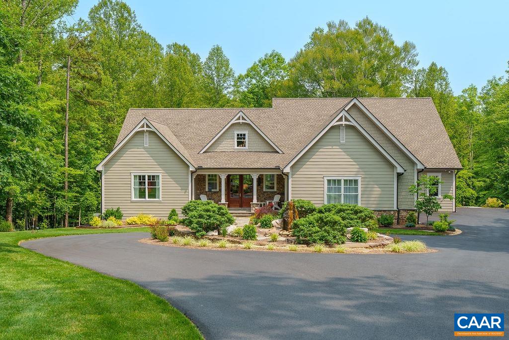 Nestled in the leafy, spacious community of Proffit Ridge, this immaculate two-year old custom home features unrivaled craftsmanship. Perfectly sited on a lot of just over 7 acres, the home rests at the end of a cul-de-sac, providing a sense of rural sanctuary while being just minutes shopping and restaurants. A total of five bedrooms: primary suite & additional ensuite on the main level, two bedrooms on the upper level, and fifth on the basement level. Each floor features common spaces: a living room and large screened porch on the main, loft living room upstairs and an expansive rec room with sunroom downstairs. The gourmet kitchen includes a large island, induction cooktop, convection oven, and walk-in pantry. Primary suite includes a spa-like bathroom with walk-in shower, Jacuzzi soaking tub, dual vanities, water closet, & custom walk-in closet. Basement level features home gym, craft room with exhaust, & walk-out to a back patio and rear of the property. The oversized garage has ample parking for 2 vehicles and a bay for a mower or ATV. Whole house generator. The solar panels provide an excellent reduction in utility costs. 15 minutes to the Downtown Mall & UVA, 8 minutes to the airport.