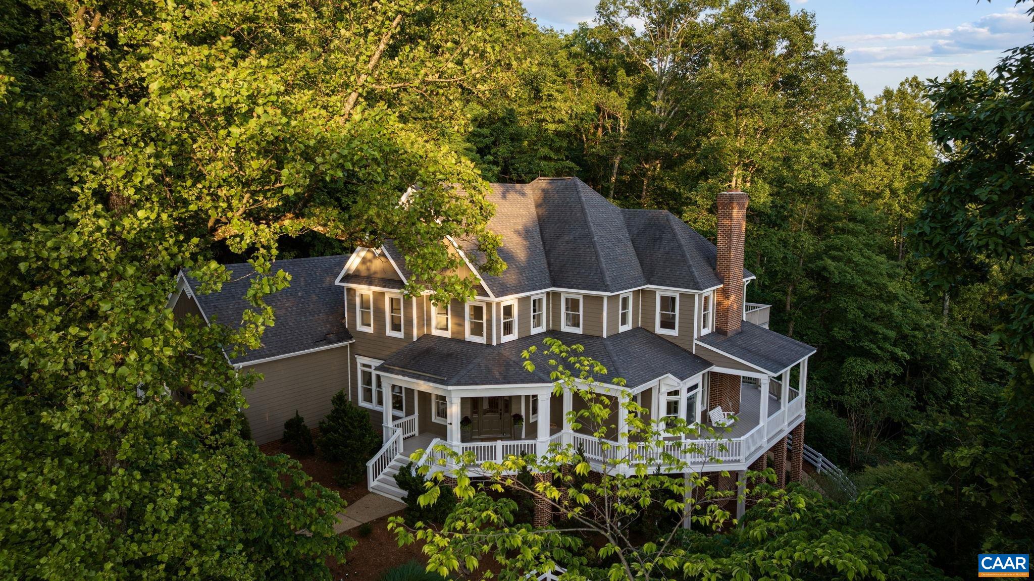 Have you ever dreamed of a totally remodeled "Park Street Style' home offering easy access to downtown and magnificent mountain views?  Welcome to 2556 Summit Ridge Trail in Ashcroft.  The architectural integrity of the home is evident with the generous wrap around porch framed by mature trees and majestic Blue Ridge Mountains.  The welcoming foyer with hand laid hardwood floors reveals a formal dining room, two staircases, and the kitchen/living room flanked by an abundance of glass.  The newly renovated kitchen boasts new high-end appliances, lavish counter tops and design features to inspire the most seasoned chefs.  Primary en suite offers privacy and the unique feature of a quiet sitting area with fireplace and a beautifully transformed bathroom. Another wing of the home has 3 bedrooms, sitting loft, private bathrooms, and a luxurious roof top deck revealing the mountain views. Terrace level maintains the exceptional architecture with large family room with stone fireplace, bar and full bathroom.  Three fireplaces and a three car garage completes this exceptional home.