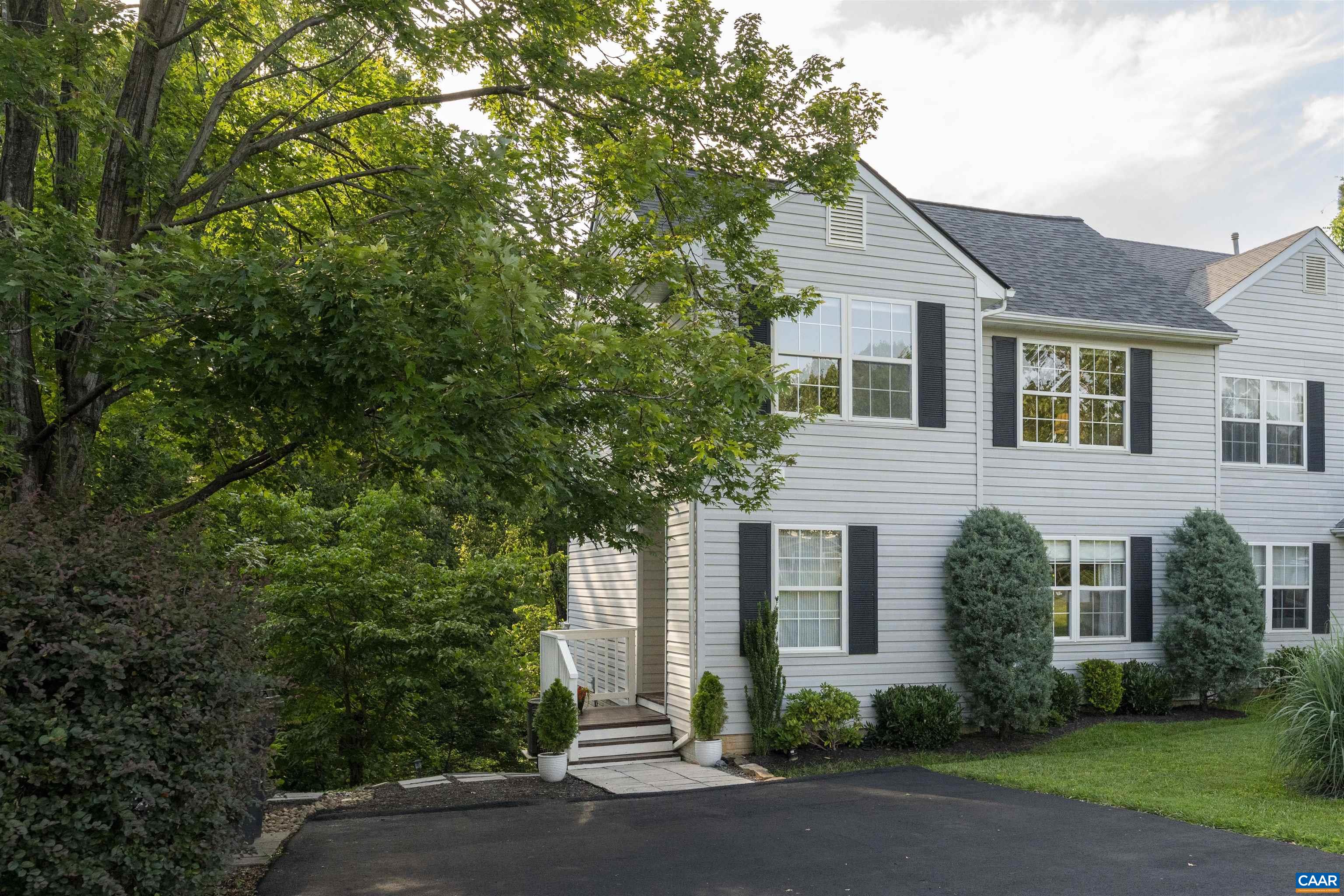 Welcome to this beautifully remodeled, three-level end-unit townhouse located in a quiet lakeside community! Enjoy the rare combination of a peaceful, low-traffic setting with outstanding amenities—just minutes from UVA, Downtown Charlottesville, and 5th Street Station/Wegmans. Inside, you’ll find 4 bedrooms and 3.5 bathrooms, including a spacious, fully updated kitchen with granite countertops, modern cabinetry, and custom lighting both inside and underneath the cabinets. The Primary Suite has a newly remodeled bathroom and a custom walk-in closet for ultimate comfort and convenience.The terrace level offers a versatile open-plan studio space complete with a bedroom area, sitting area, full bathroom, and has been successfully rented for $1500 per month. Luxury vinyl plank flooring flows throughout the home, with stylish tile in all bathrooms.Step out from the dining area onto a private deck overlooking wooded views and enjoy direct access to the lake, neighborhood walking paths, and miles of scenic trails including Biscuit Run Park. The community also features a clubhouse with a fitness center, pool, and tennis/pb courts.Conveniently located near area schools and Cville. New Roof and Furnace/HVAC 2024. OPEN HOUSE SAT 1-3.