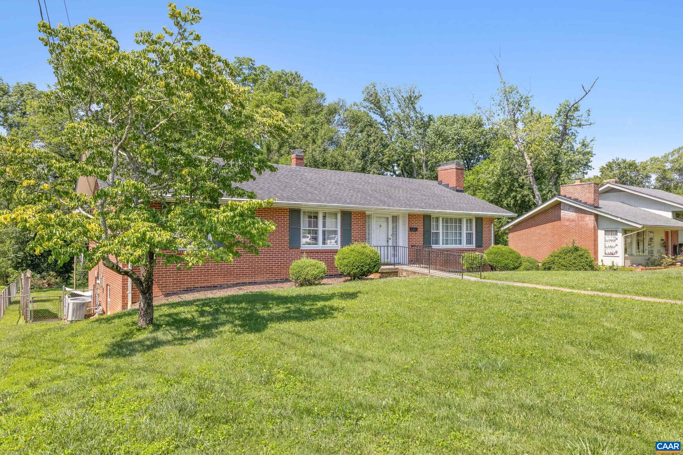 Experience the ease of one-level living in this well-maintained brick rancher, ideally located just off Route 250 and less than a mile from downtown Charlottesville. Enjoy the perfect blend of city convenience and neighborhood charm! Step outside and take advantage of walkable access to Unity Field—right across the street—for a casual soccer game or some playtime with your dog. Northeast Park is just around the corner, offering even more green space and recreation. Inside, you'll find timeless features including two cozy wood-burning fireplaces, a sunroom just off the kitchen, and a primary bedroom with en suite bath. The spacious, nearly level backyard includes a storage shed and is perfect for gardening, entertaining, or simply relaxing. Downstairs, a large basement rec room with a built-in vintage bar invites fun and flexibility. There’s also ample unfinished space ideal for storage, a workshop, or your favorite hobbies. With plenty of off-street parking, this home truly has it all—space, charm, and an unbeatable location. Don’t miss your chance to own a classic Charlottesville home!
