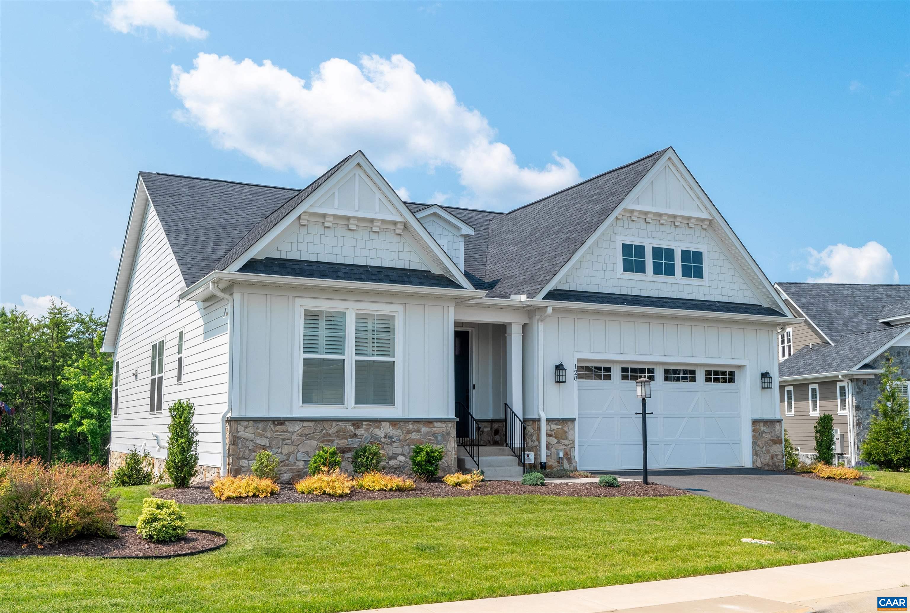 Designed and built in 2022 by premier local builder Greenwood Homes, this like new house offers four BRs and three full BAs, 2,759 finished square feet of easy, refined living and craftsmanship. Set on a large golf course lot, it features main level living and a spacious walkout terrace level. This light-filled house features 9-foot ceilings, custom window shutters throughout, and is wired for a premium home theater, expanded Wi-Fi, and security system. The great room boasts a dual facing gas stone fireplace for relaxing inside or when on the screened porch overlooking the expansive backyard. The contemporary kitchen impresses with a custom wine cabinet, travertine ledger backsplash, granite countertops, and stainless-steel appliances. The terrace level has direct access to the outdoor patio and can be used for entertainment space or a family room, and affords four seasons views of the natural scenery. Major upgrades include LVP flooring, a tankless water heater and a 24-kW whole house generator. Outdoor living spaces shine with professional landscaping and a custom paver patio with sitting walls. Peaceful, level backyard is secluded, buffered by the golf course and fully fenced. This well-maintained property is an absolute gem!