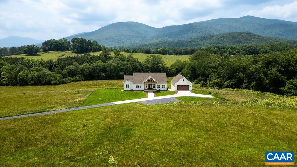 Located in one of the most desirable areas of Afton, Virginia, this stunning 5-bedroom, 4.5-bath home sits atop 20 acres of breathtaking mountain views. Built just two years ago, it offers the perfect blend of modern comfort and serene country living.With no restrictions or HOA, this property is ideal as a private family compound with space for additional homes, or as a picturesque horse farm with a separate barn. Whether you're seeking a primary residence, a weekend retreat, or an income-producing investment, this oasis fits the bill—currently generating a net income of $95,000 annually.Offered fully furnished and sold turnkey, this exceptional property is ready for you to move in and enjoy from day one.