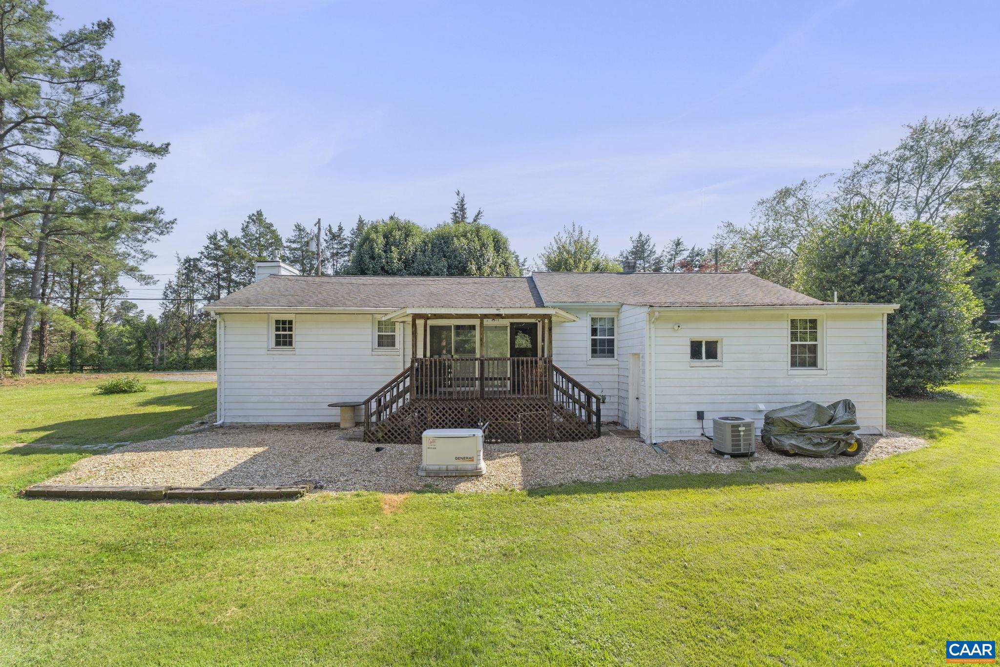 This well maintained 1946 Albemarle County ranch style home is located just 5 miles from Charlottesville in the Monticello High School district. Offering 3 bedrooms & 2 full baths this home is move-in ready or ready for updating whichever you prefer! The large living room has beautiful hardwood floors, a gas log fireplace, and large walk-in closet. The electric service panel was upgraded in 2008 with a 200 Amp breaker box. The roof was replace in 2008 with 30 year fiberglass shingles. The windows were replace in 2016 by Window World. The propane gas furnace was serviced in October 2024. There is a whole house generator, a 1000 gallon propane tank, a large storage shed, off street parking for multiple cars, and a nearly level .60 acre lot.