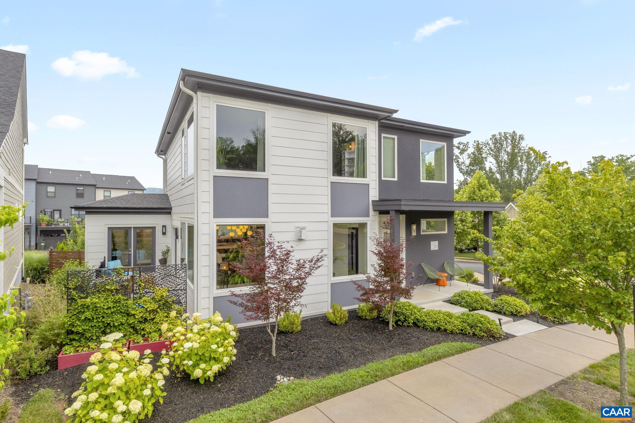 Located in the highly sought-after neighborhood of Lochlyn Hills, this beautiful home built by Arcadia Builders in 2020 is a rare offering. The main level features a modern open floor plan with soaring ceilings and huge windows throughout (with custom top-down, bottom-up blinds), a cozy gas fireplace, and a gorgeous kitchen with high-end appliances, including a Wolf gas stove, and Bosch dishwasher, fridge, and microwave. There’s also a dedicated office space, a convenient half bath (with fresh paint!), and a laundry/mudroom, easily accessed from the attached garage. Both the office and living area open to a lovely two level outdoor patio, perfect for relaxing or entertaining. Upstairs, you’ll find three spacious bedrooms, each with its own ensuite bathroom and plenty of closet space. The primary suite includes a private balcony with mountain views. With easy access to the Rivanna Trail system and Pen Park, this is a fabulous home in an equally fabulous neighborhood!