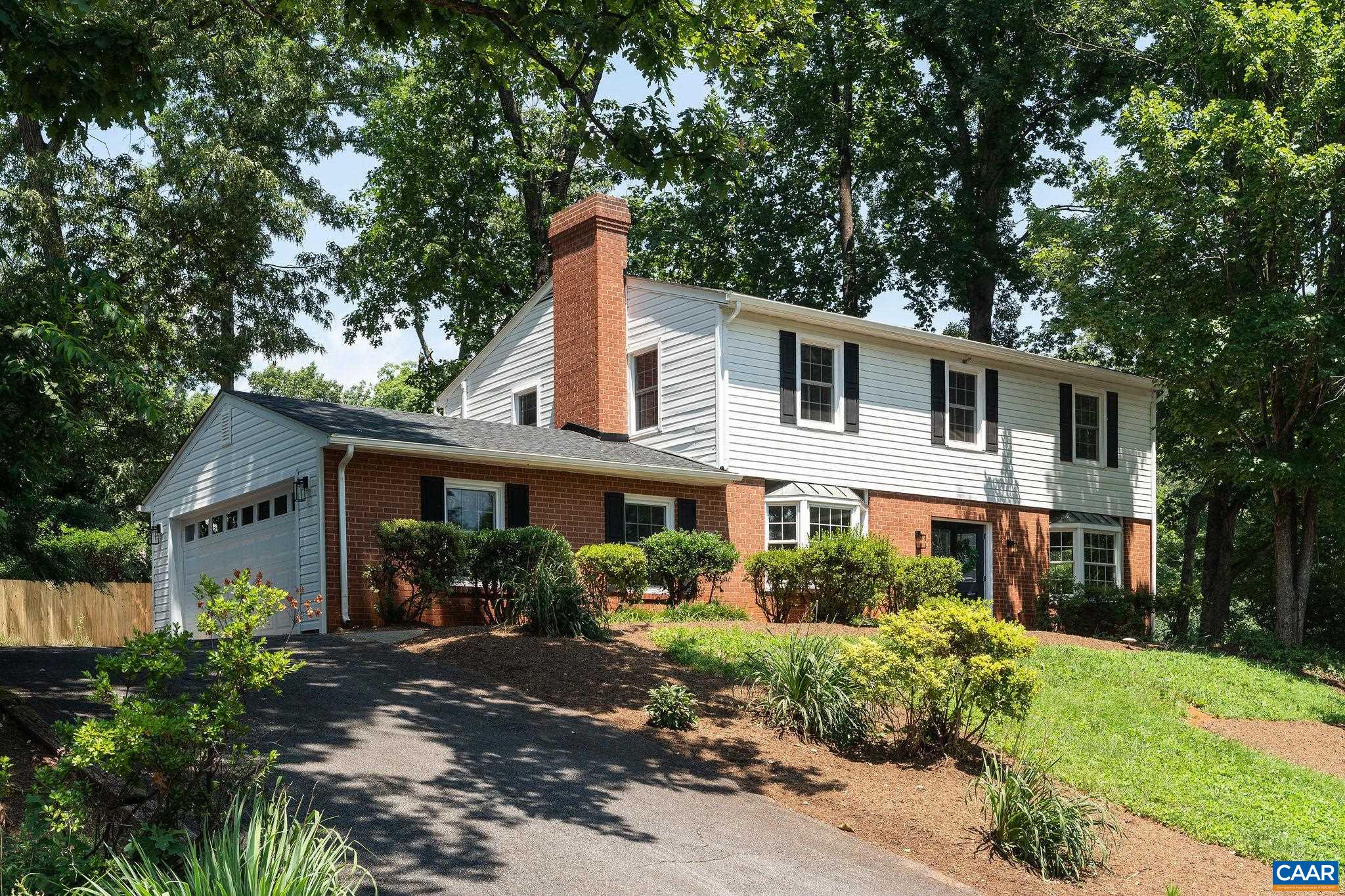 Welcome to Johnson Village, one of Charlottesville’s most poppin' neighborhoods—where the AC is cold, the neighbors are friendly, and this freshly renovated 4-bed, 2.5-bath beauty on a 1/4 acre corner lot is ready to make your homeownership dreams come true! Inside you're greeted by not one, but two living rooms. The open-plan kitchen is pure chef’s kiss with brand new cabinets,  stone counters, & stainless appliances. There is a sunny eat-in kitchen, breakfast bar, and dining room. When the weather cools, cozy up by the fireplace with your favorite warm drink. Upstairs, there are 4 bedrooms, including a large primary suite with its own private half bath. The laundry is conveniently located right where you actually need it - on the 2nd floor - because let’s be honest, nobody enjoys hauling baskets up and down stairs. Plus, the attached two-car garage just off the kitchen means you’ll never have to scrape ice off your windshields again. Flaunting new windows, new HVAC, new 2-car garage door with opener (wifi enabled) and a new 30-yr ROOF with warranty! With the bonus of top-rated schools, quiet tree-lined streets for walks, and close proximity to local conveniences, you'll want to schedule your tour ASAP!! **Video tour available**
